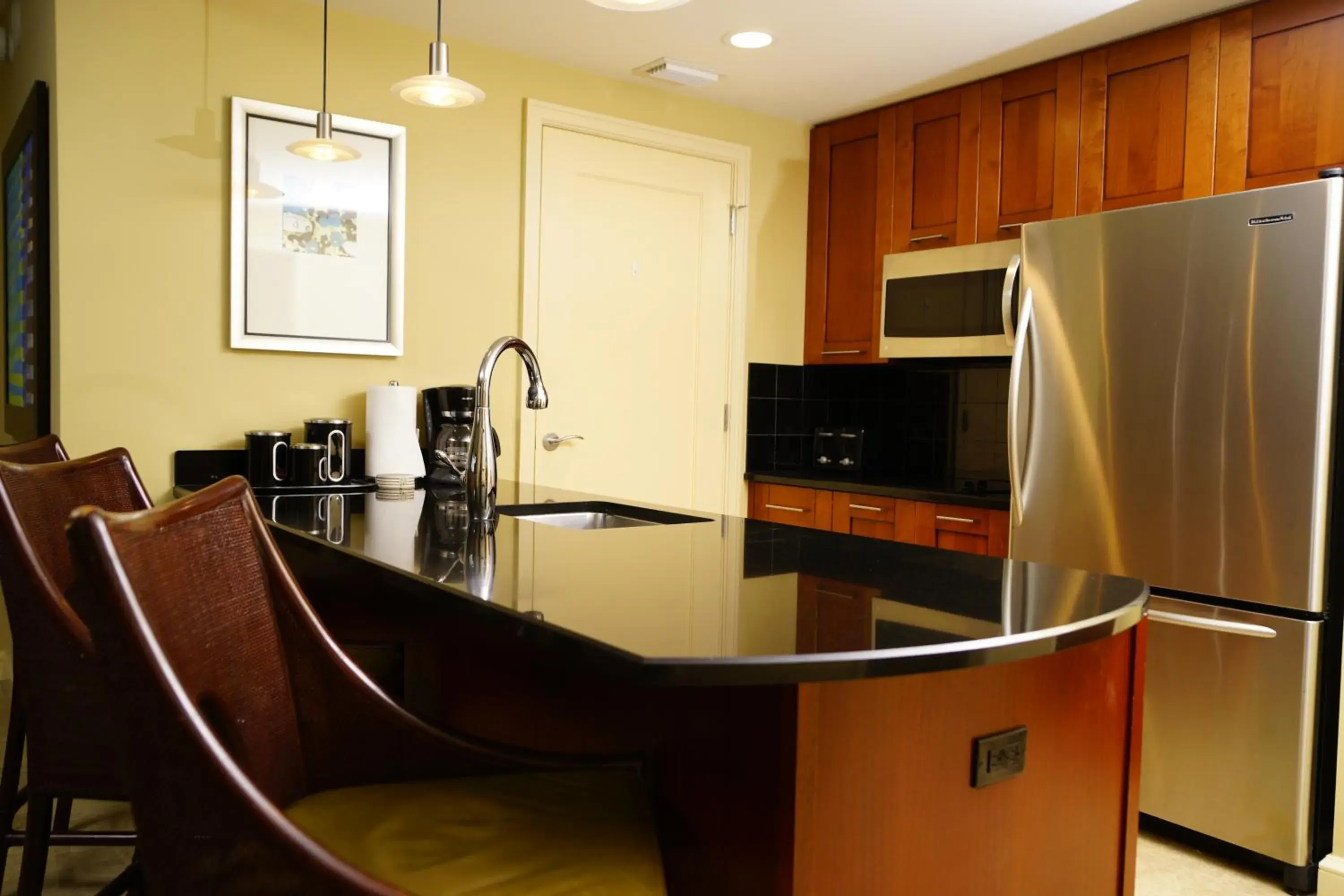 Kitchen/Kitchenette in Palm Beach Singer Island Resort & Spa Luxury Suites