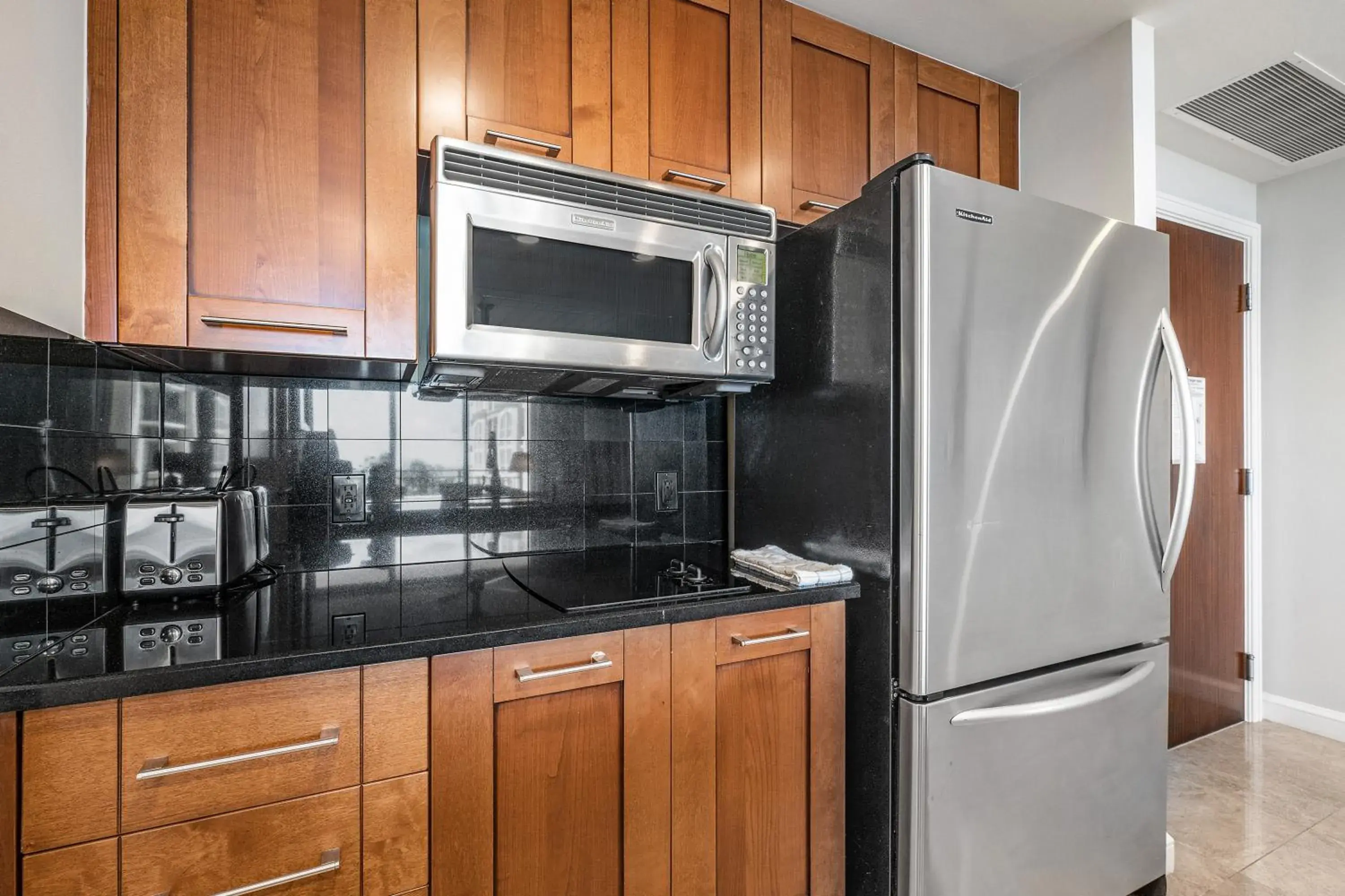 Kitchen/Kitchenette in Palm Beach Singer Island Resort & Spa Luxury Suites