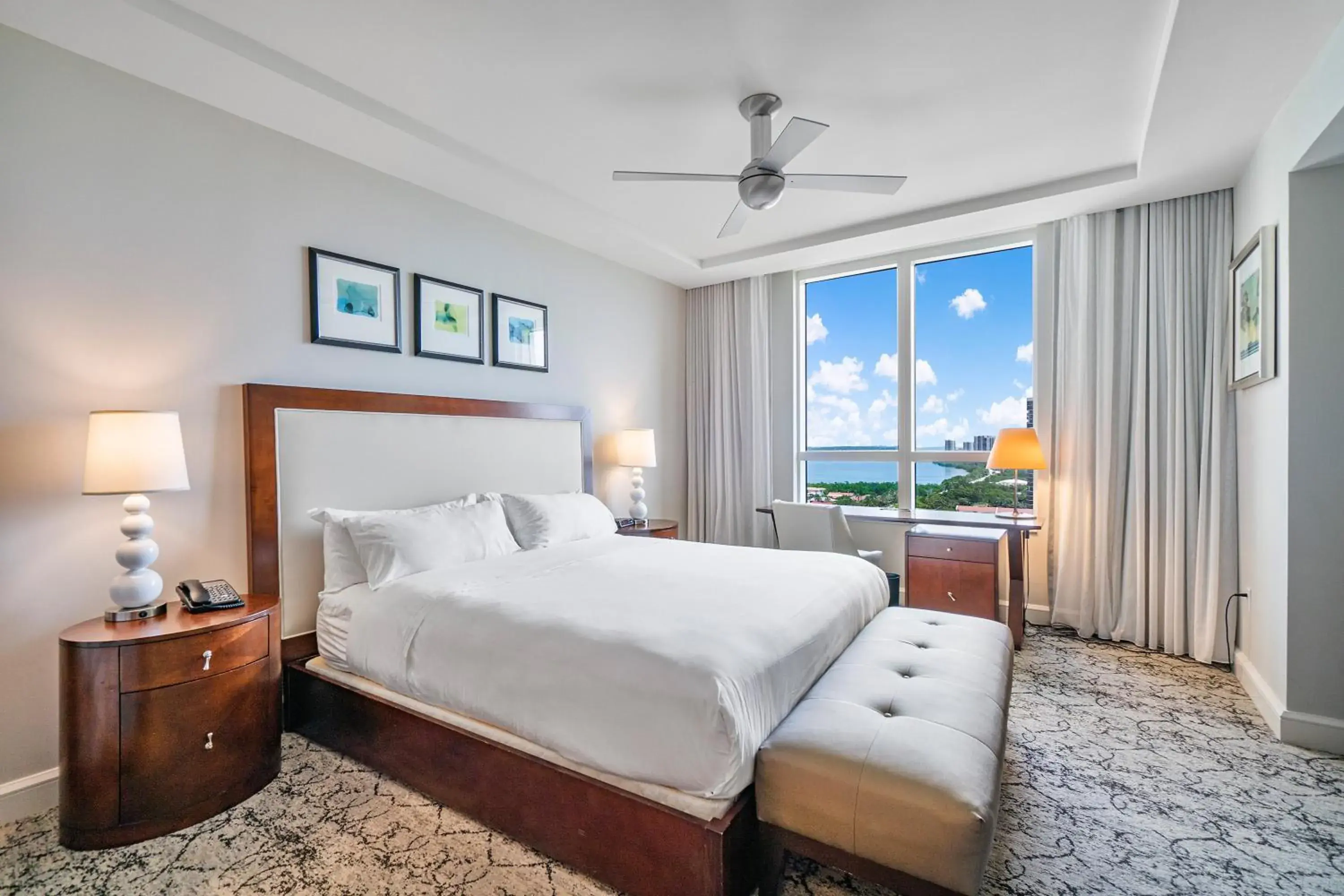 Bed in Palm Beach Singer Island Resort & Spa Luxury Suites