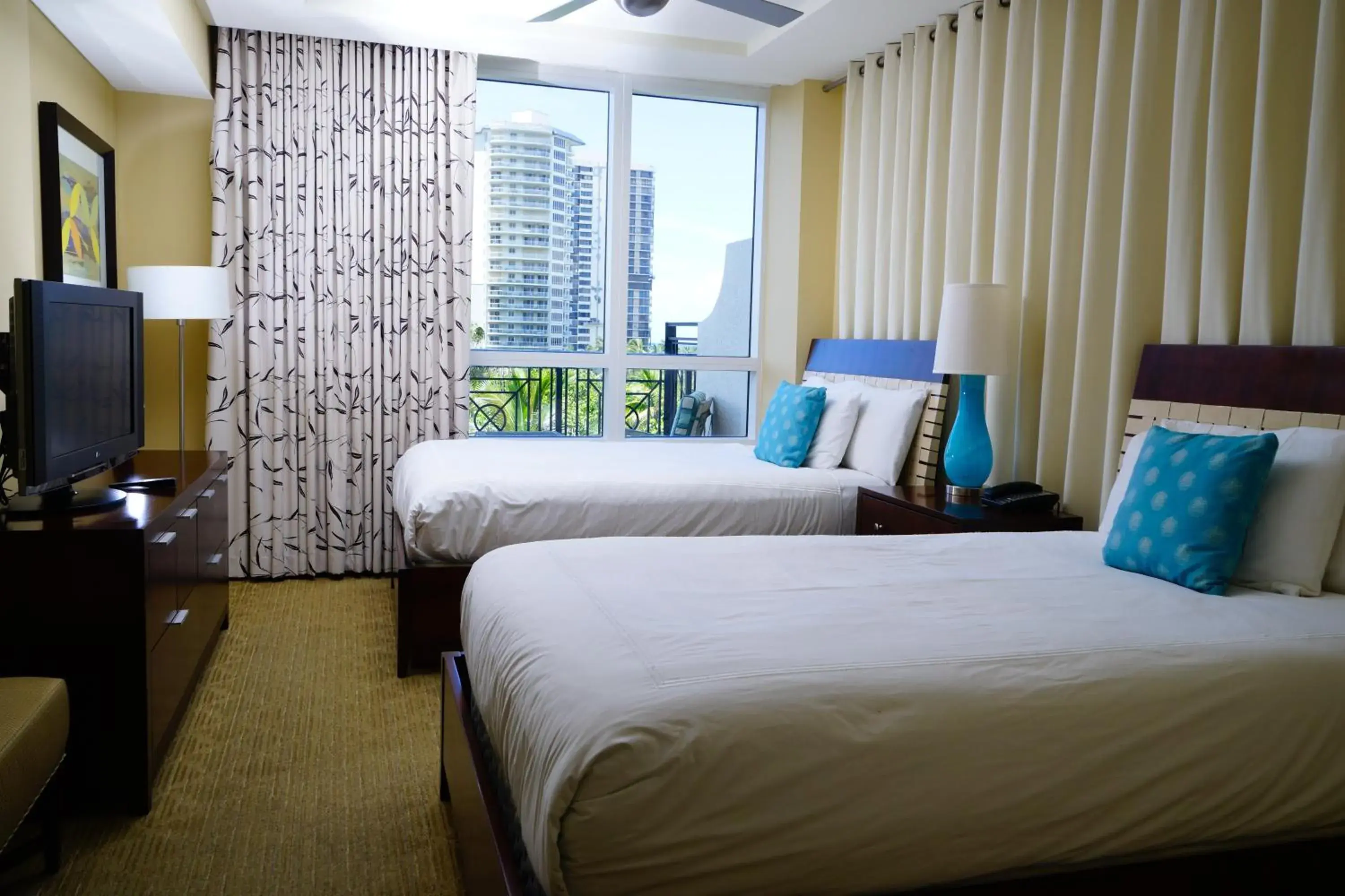 Bed in Palm Beach Singer Island Resort & Spa Luxury Suites