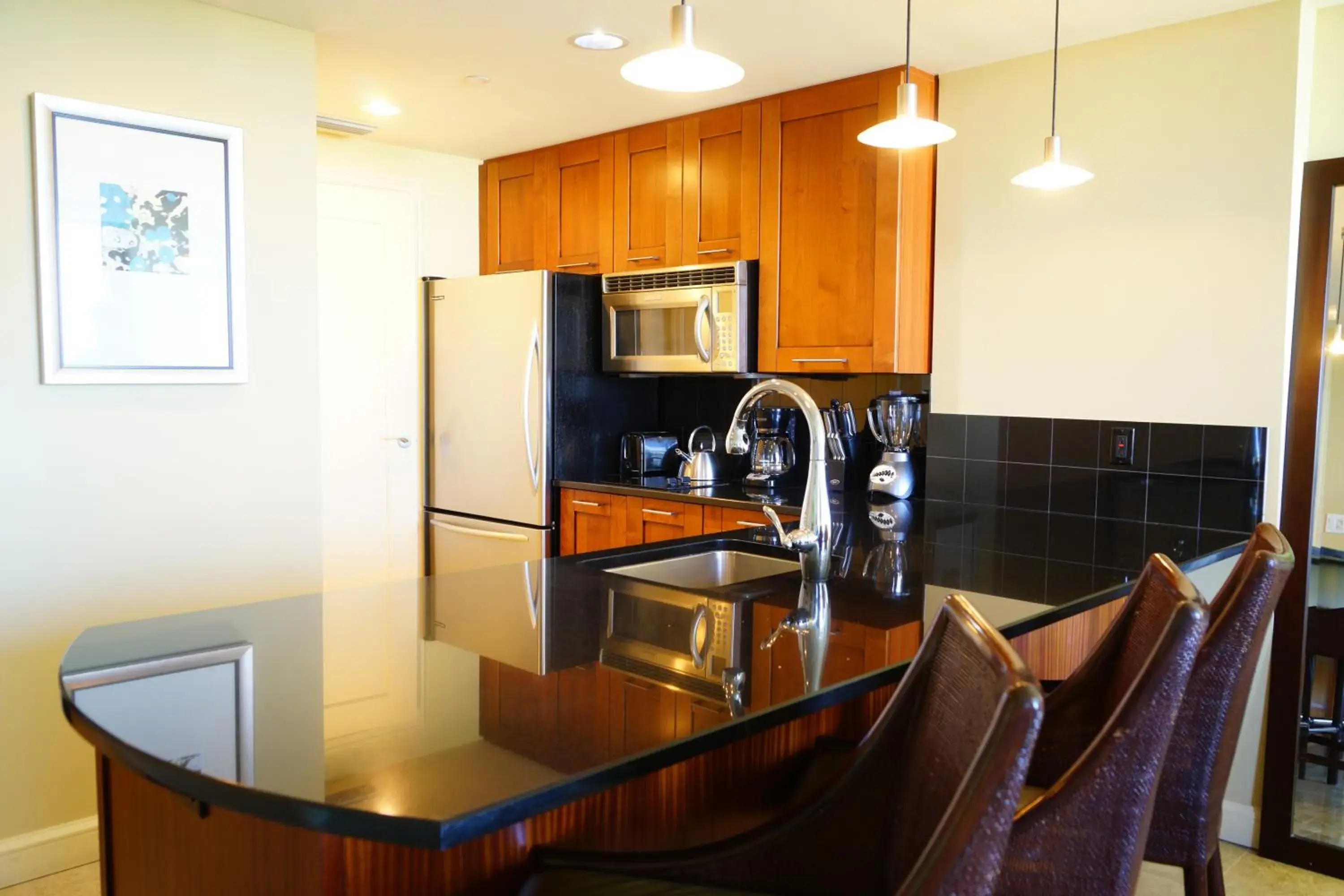 Kitchen/Kitchenette in Palm Beach Singer Island Resort & Spa Luxury Suites