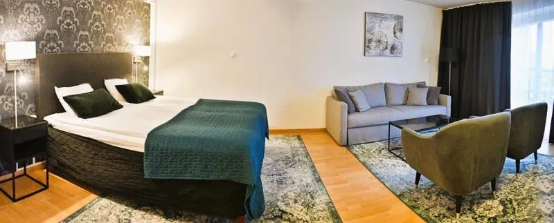 Living room, Bed in Hotel Amadeus by First