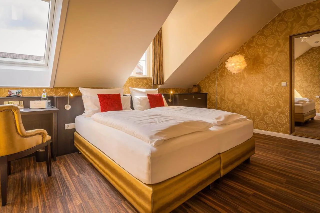 Bed in MOMENTS Boutique Hotel