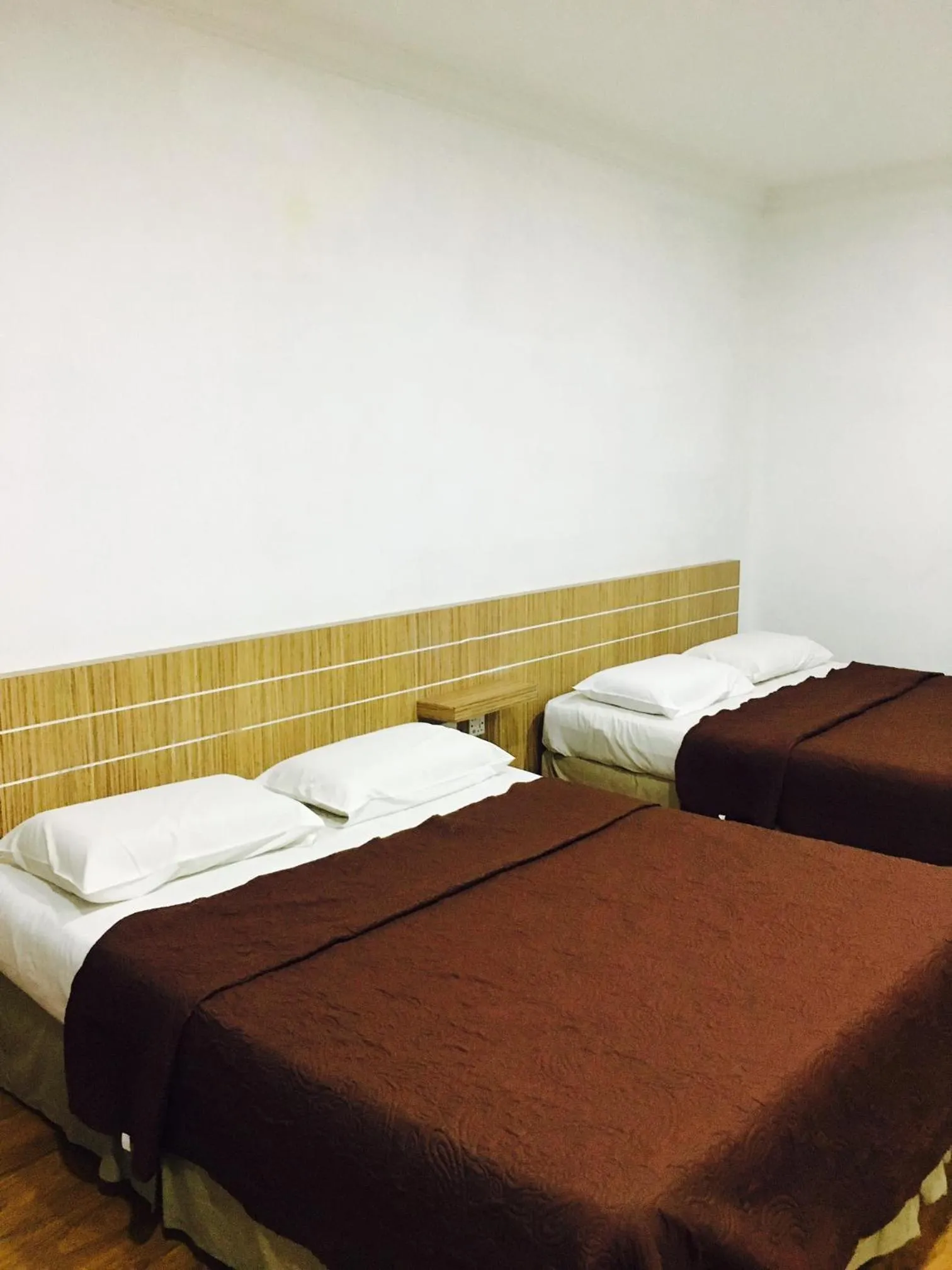 Bed in Landcons Hotel & Resort