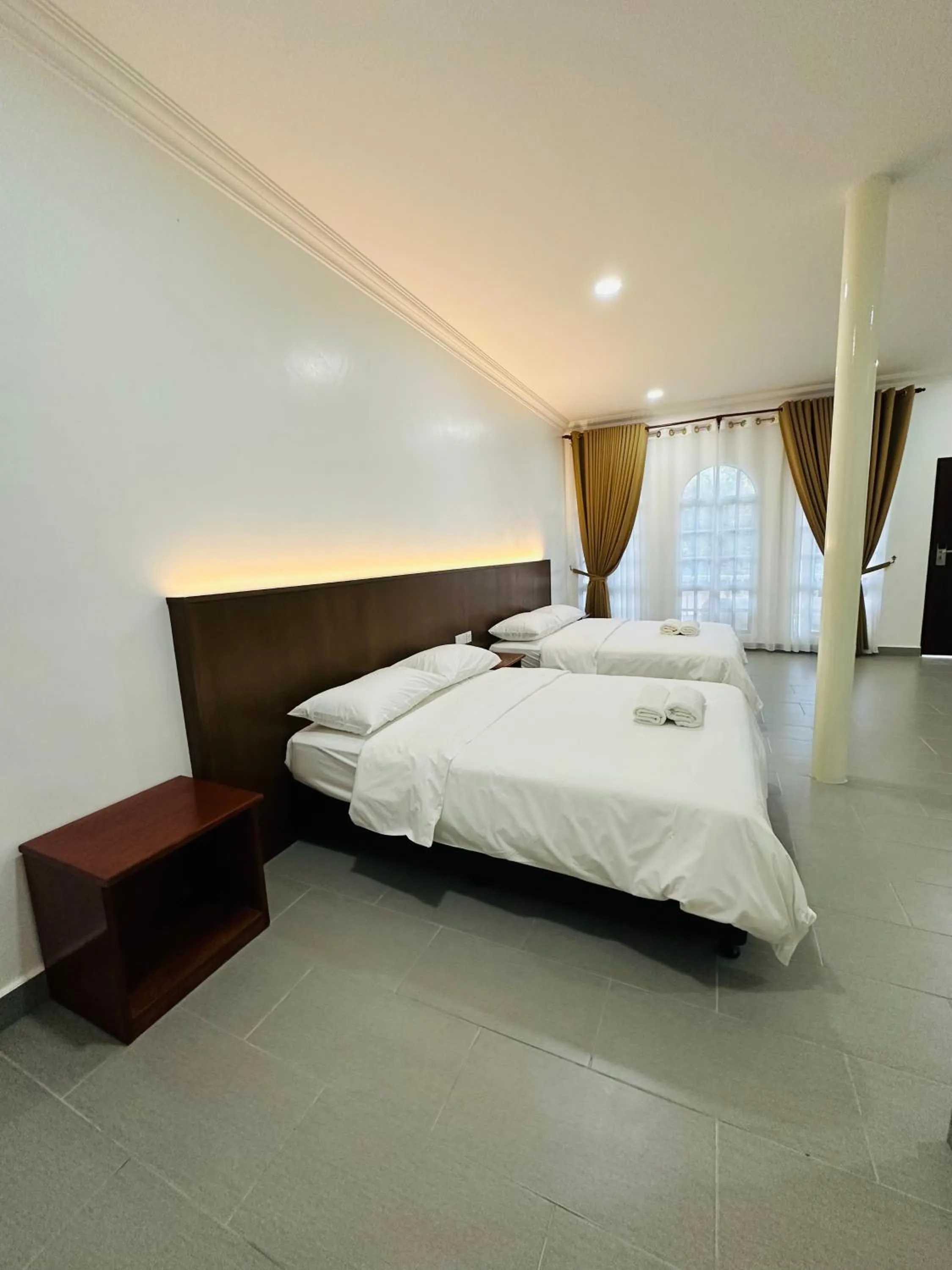 Bed in Landcons Hotel & Resort