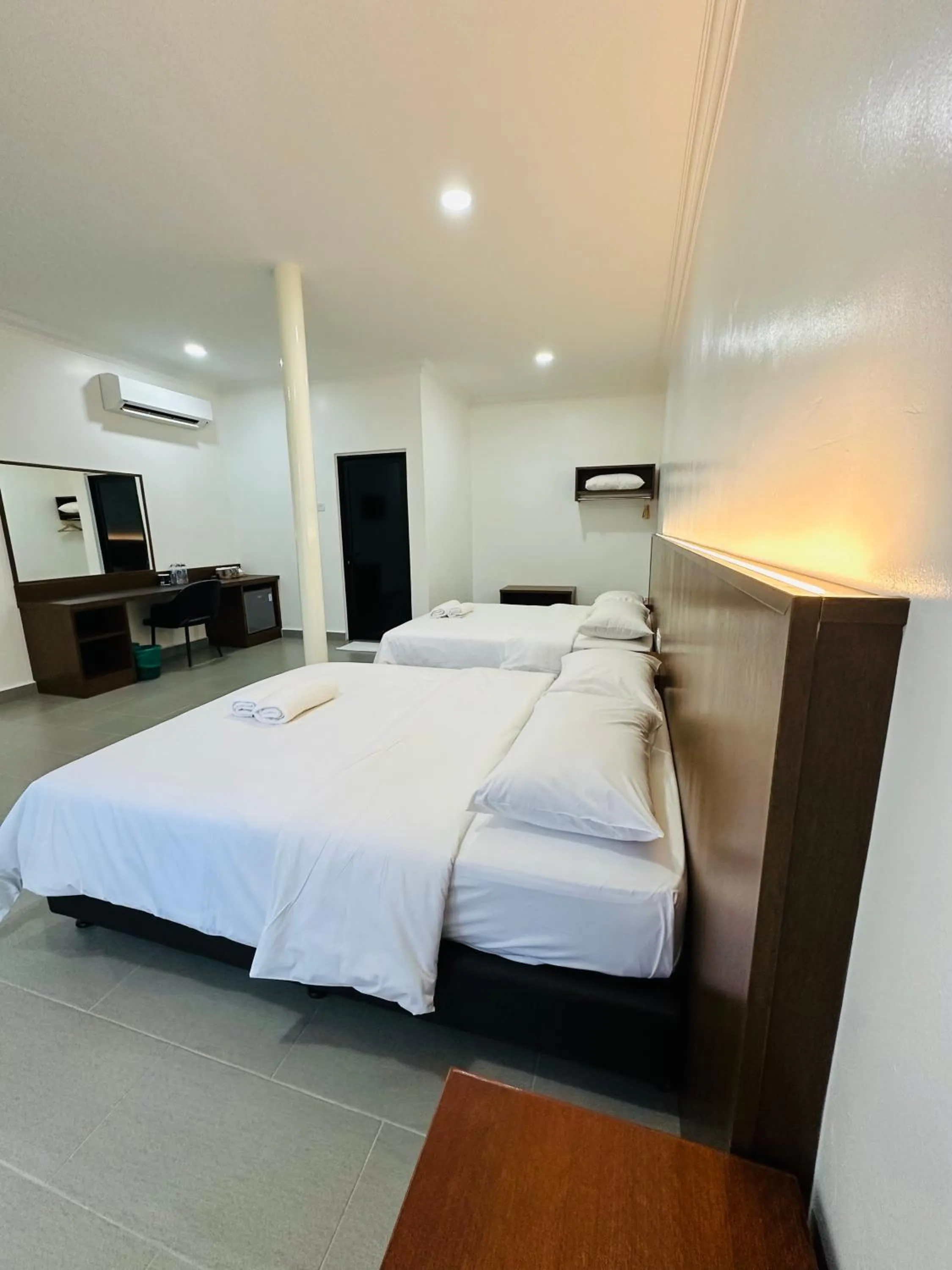 Bed in Landcons Hotel & Resort