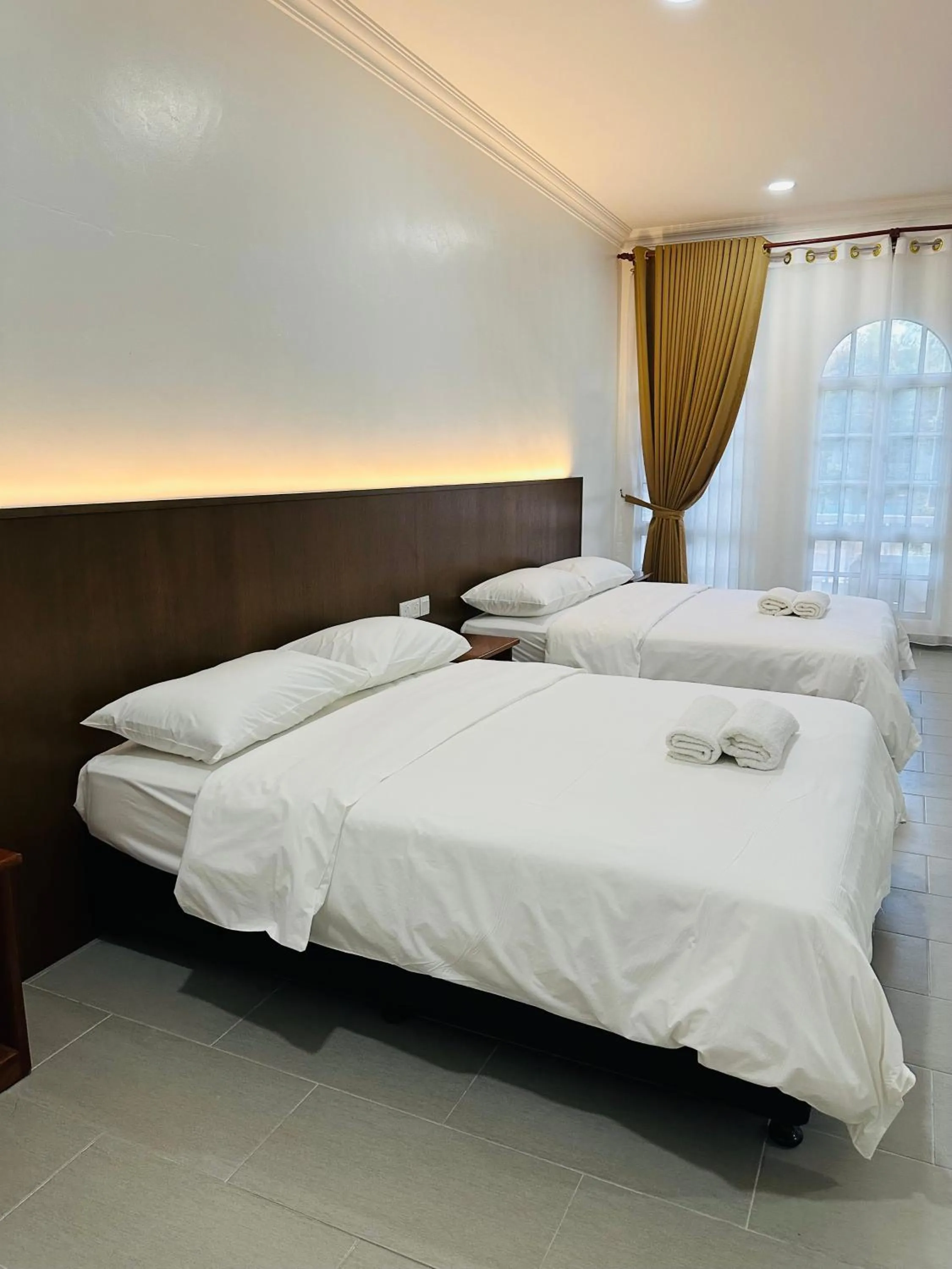 Bed in Landcons Hotel & Resort