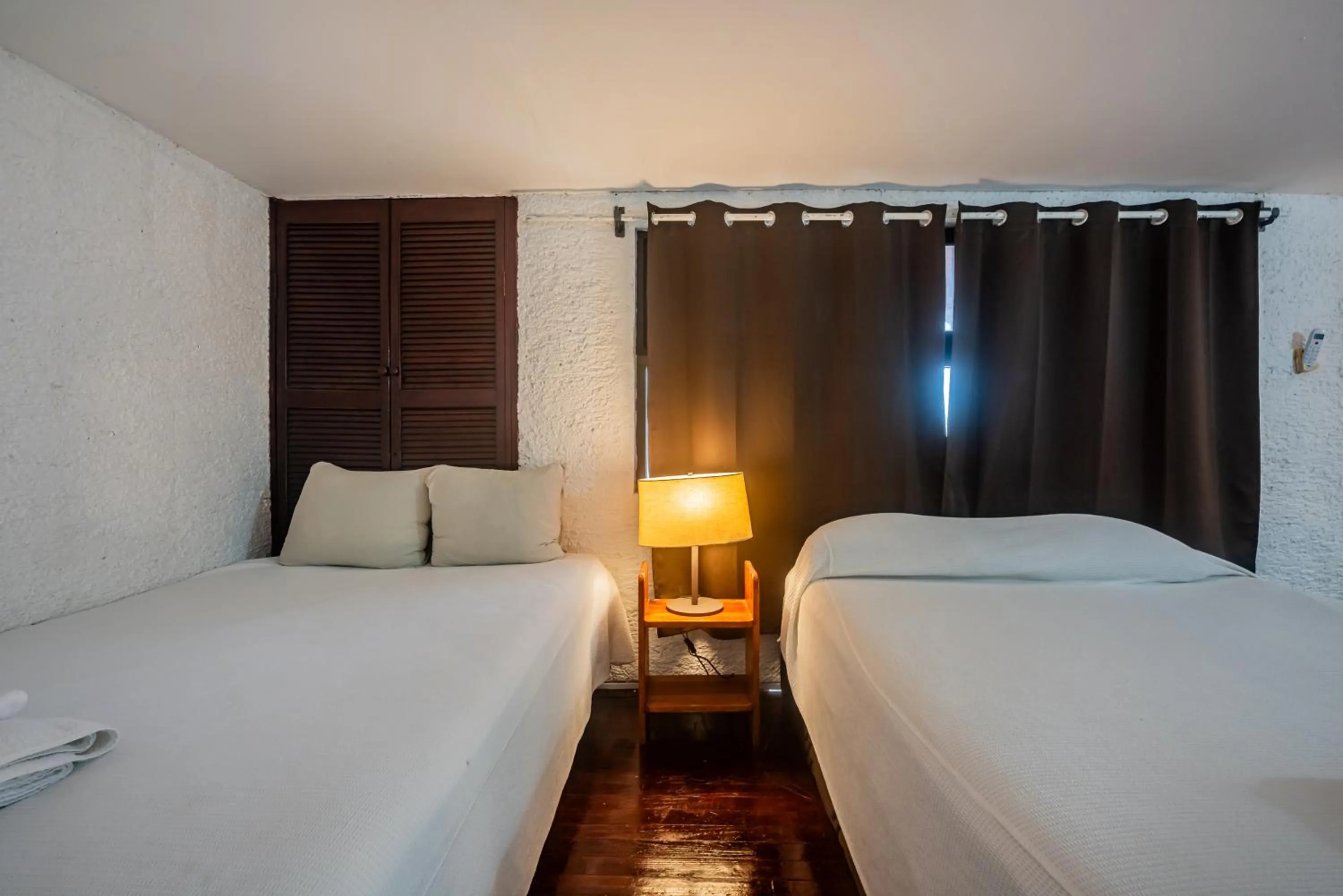 Bed in Cancún Suites Apartments - Hotel Zone