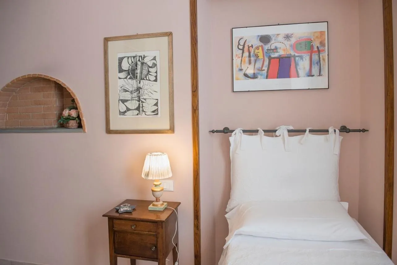 Bed in Affittacamere Benedetta