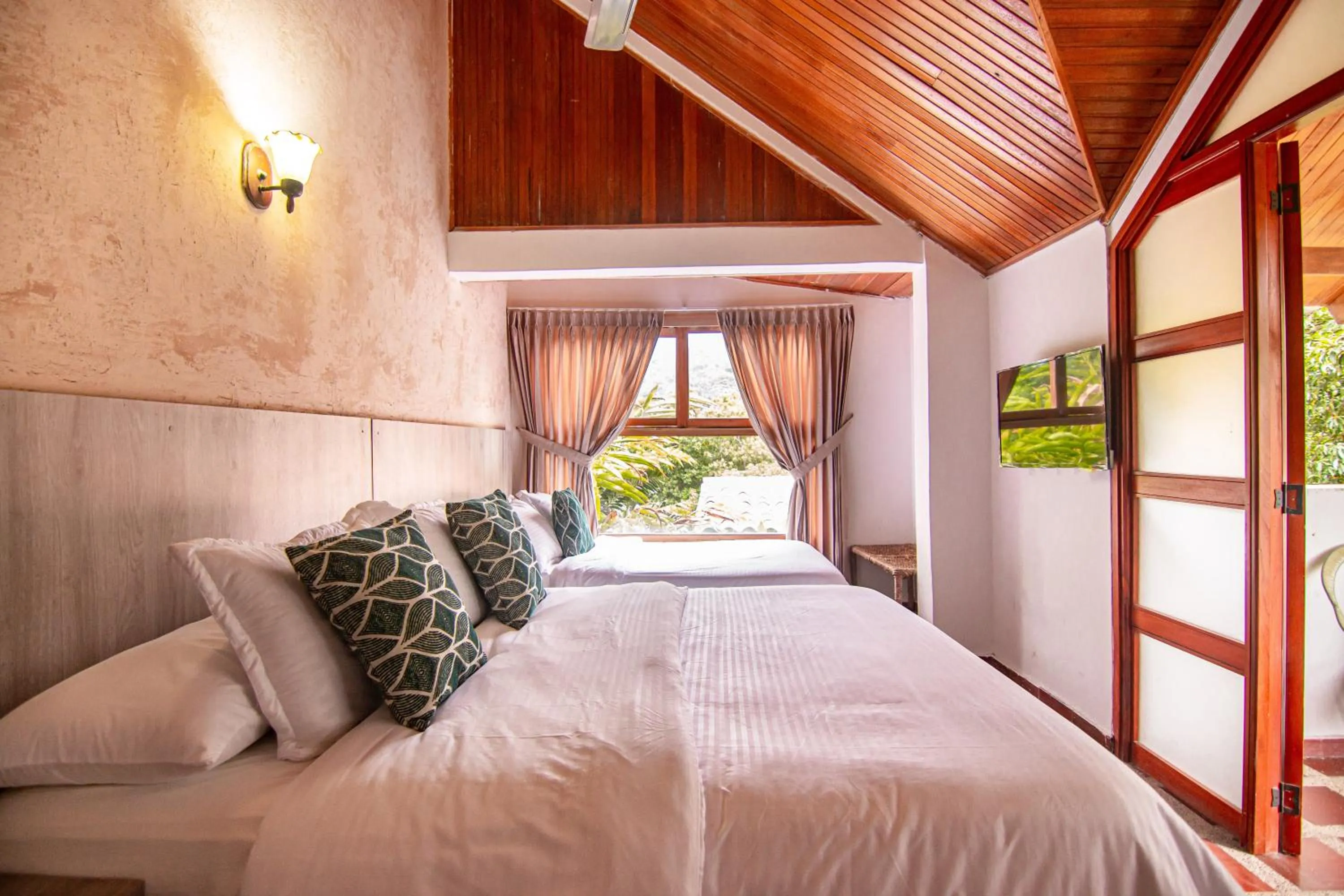 Bed in Portales del Tayrona Garden Hotel