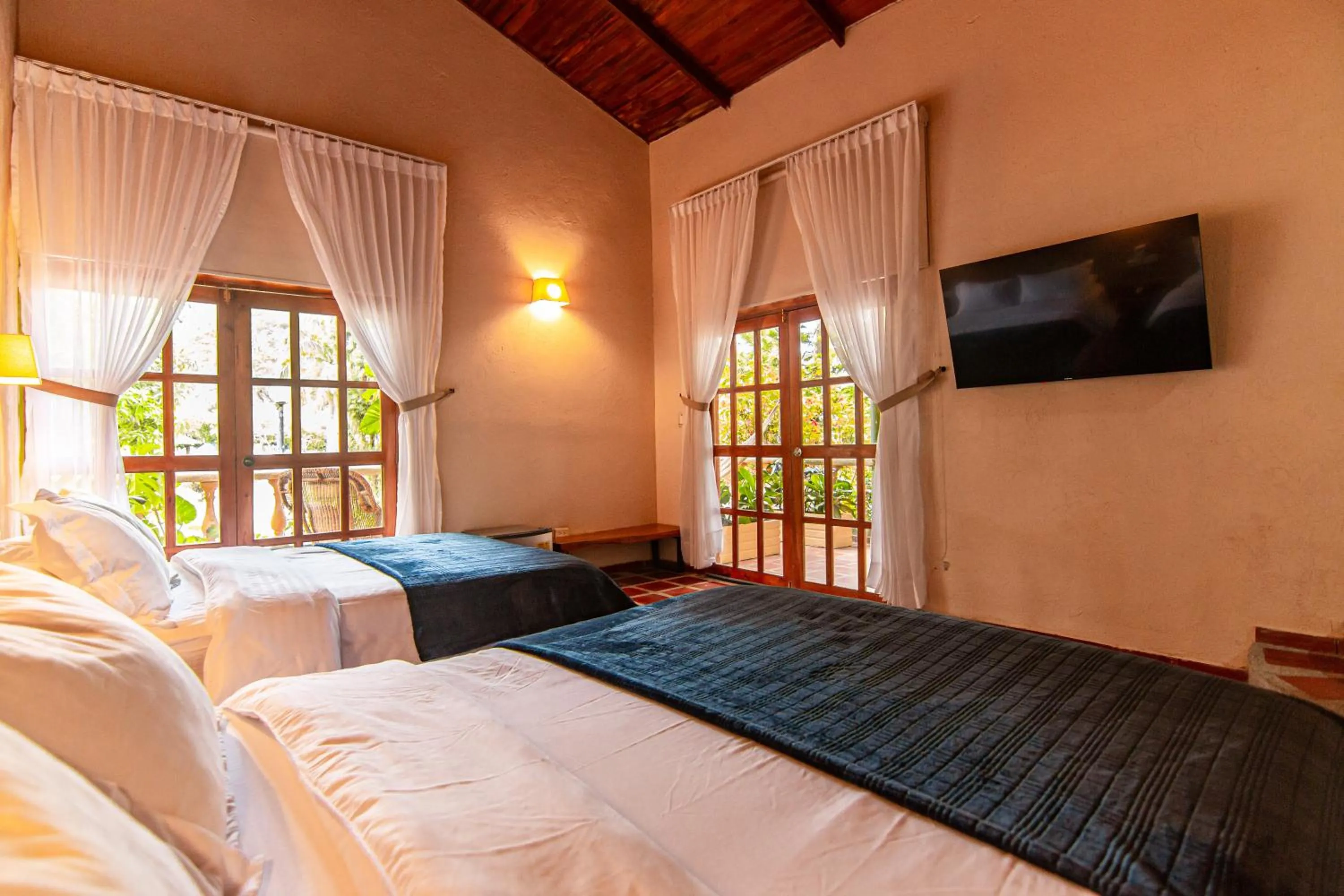 Bed in Portales del Tayrona Garden Hotel