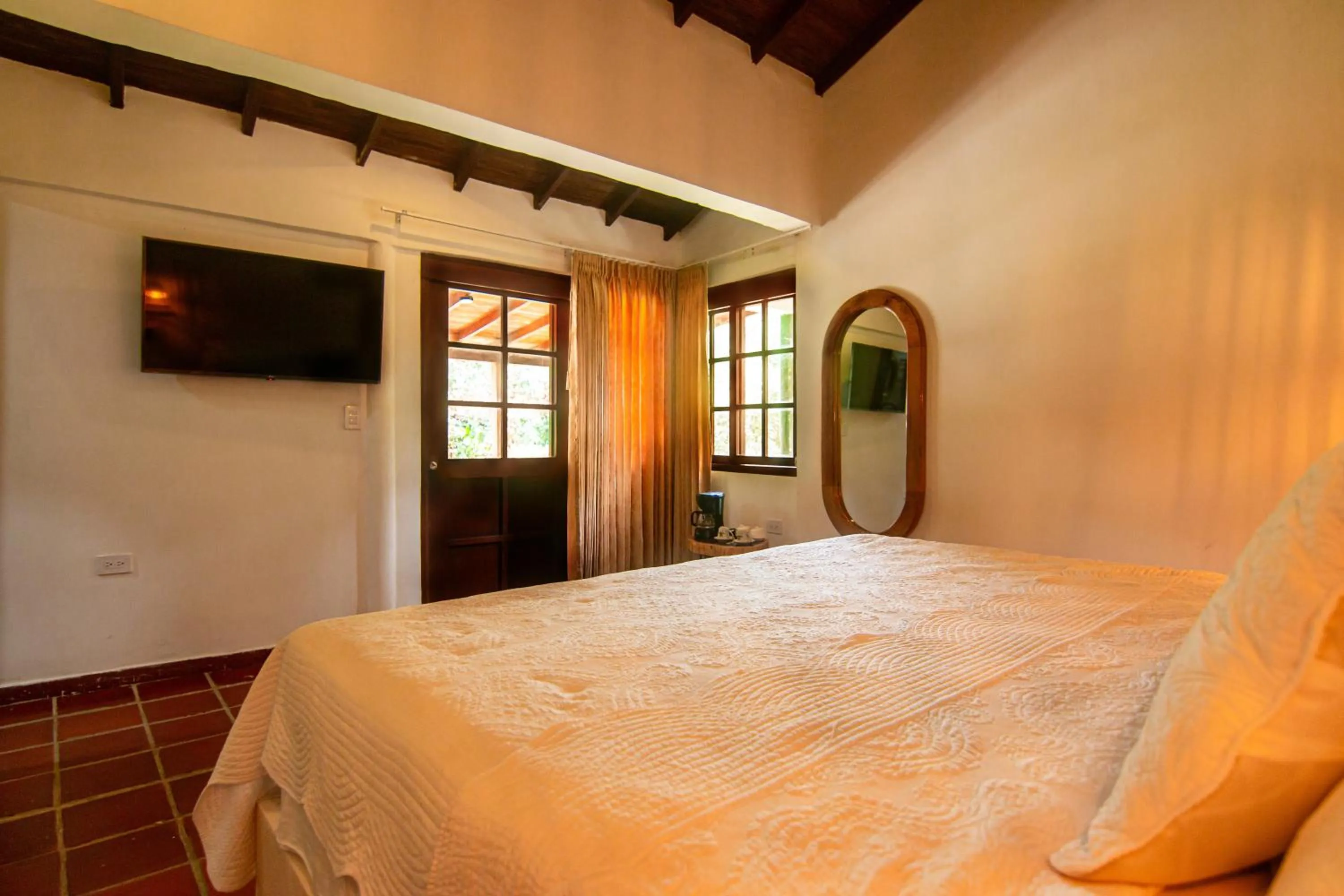 Bed in Portales del Tayrona Garden Hotel