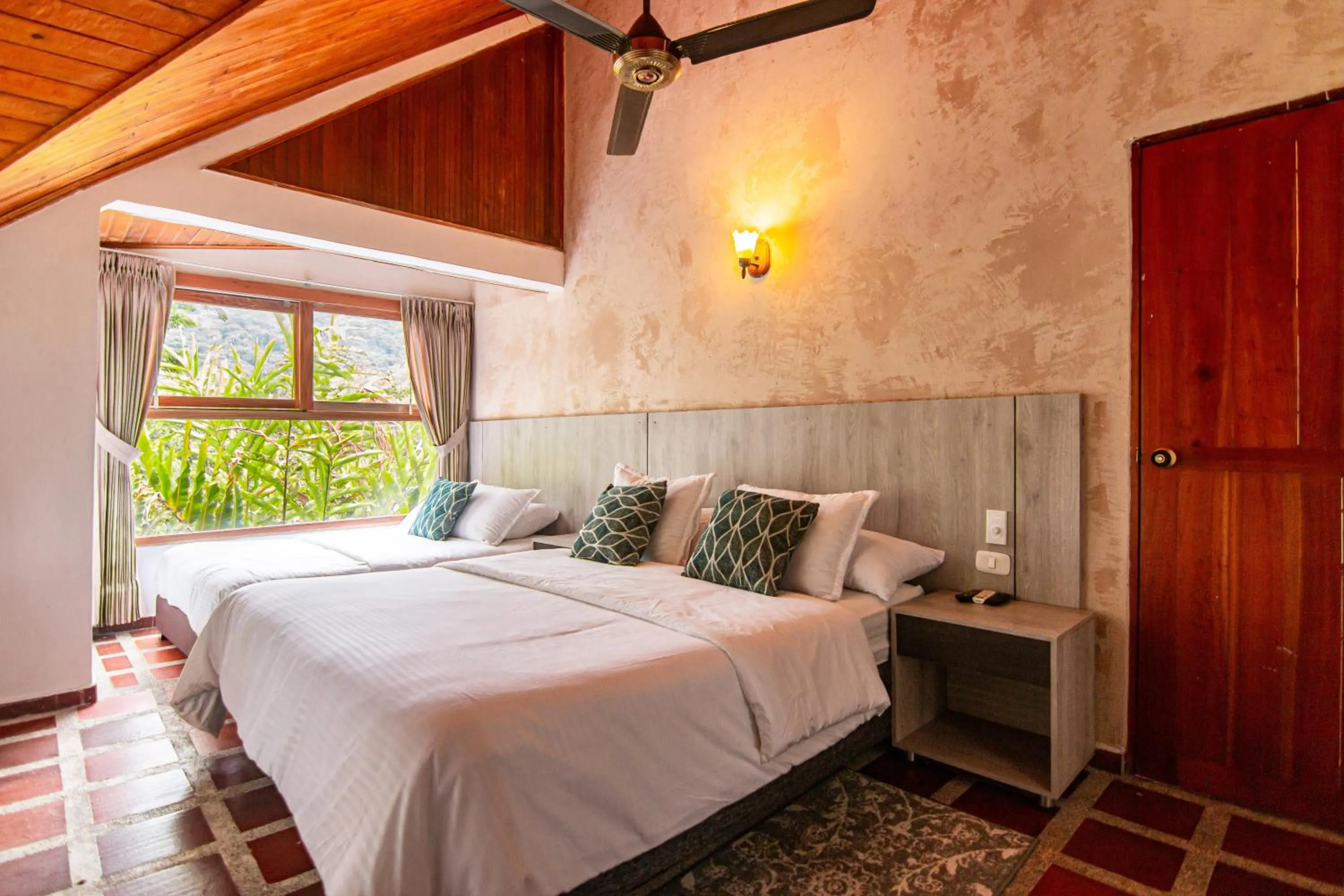 Photo of the whole room, Bed in Portales del Tayrona Garden Hotel