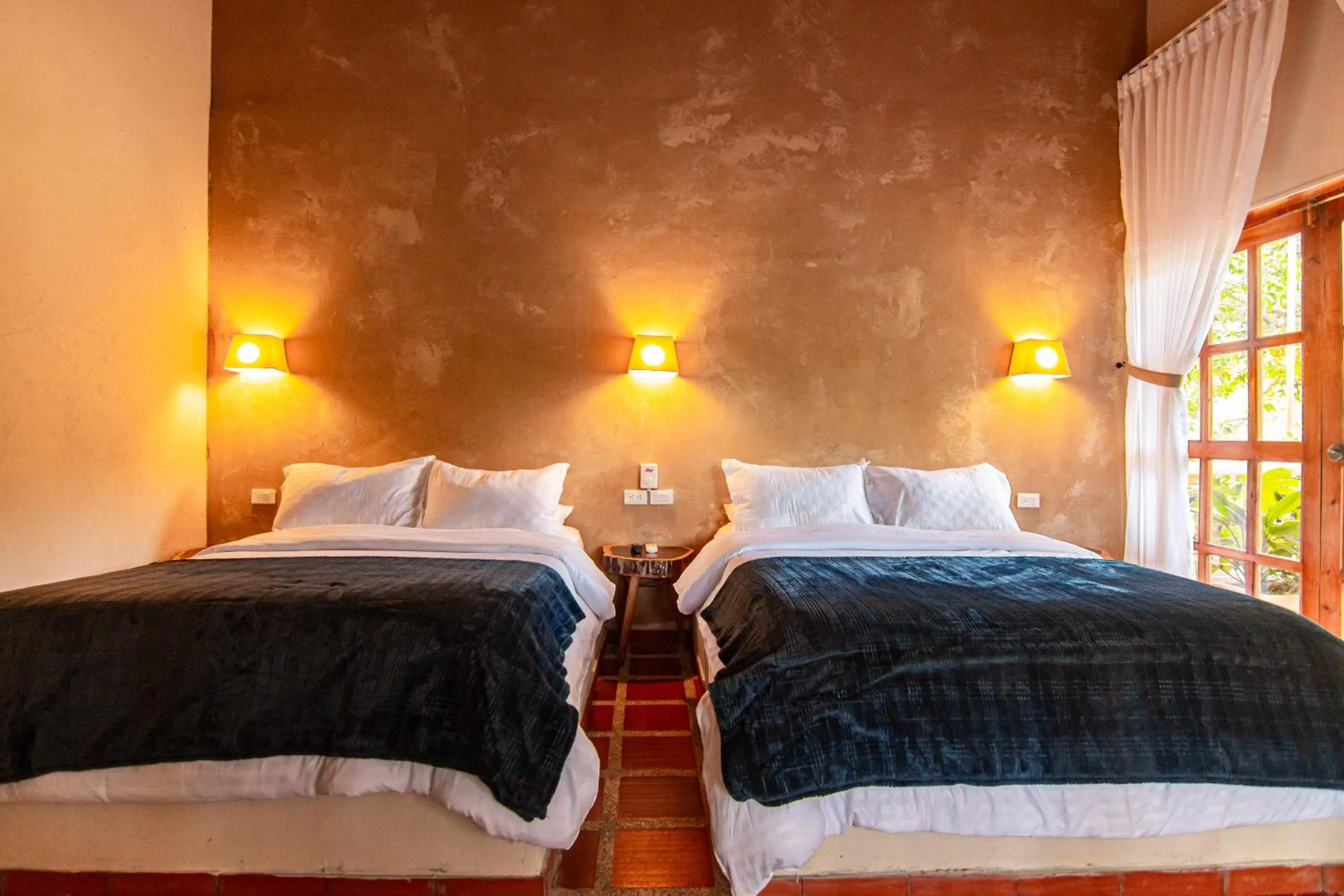 Bed in Portales del Tayrona Garden Hotel