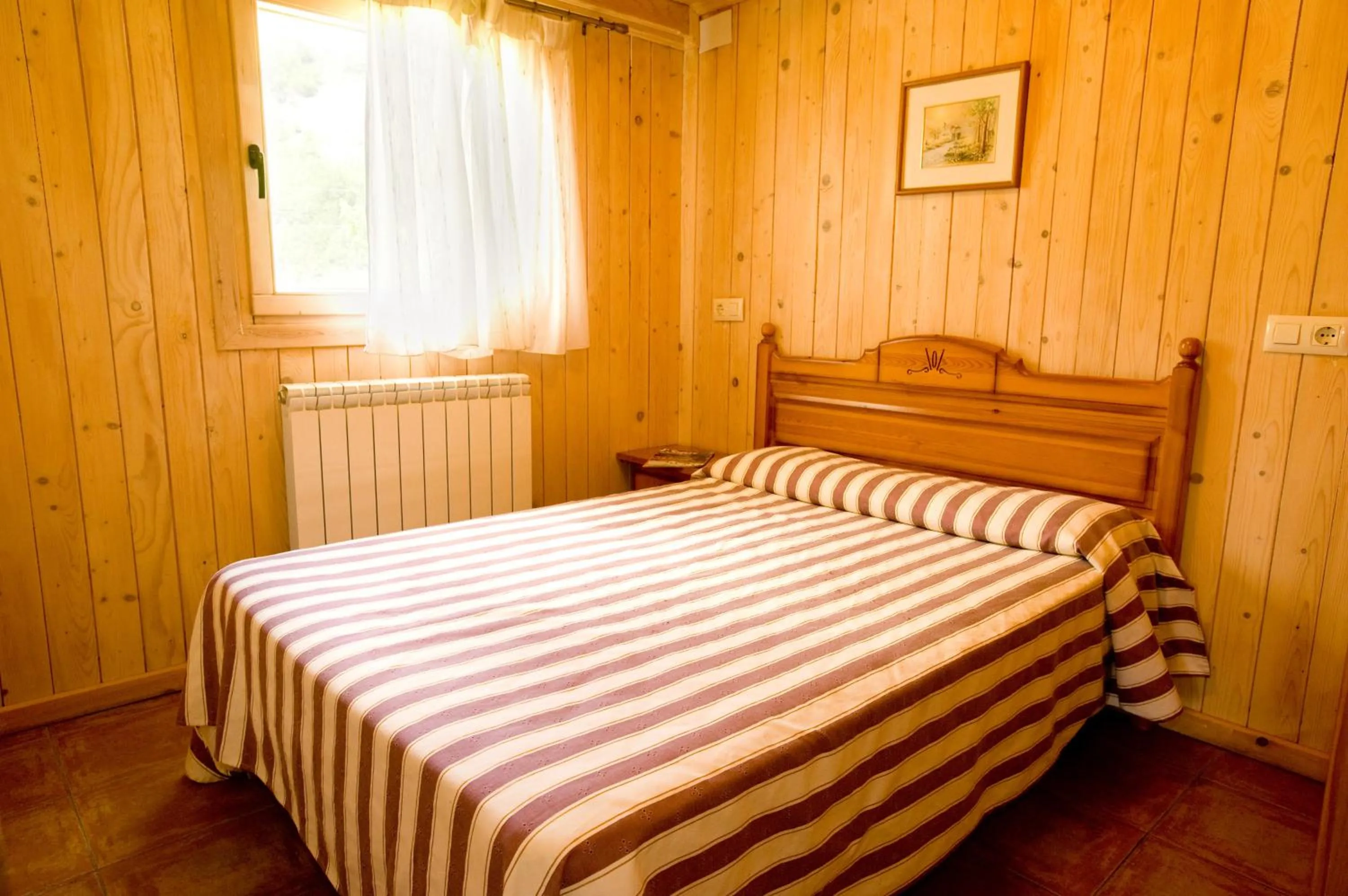 Bed in Bungalows La Borda d´Arnaldet