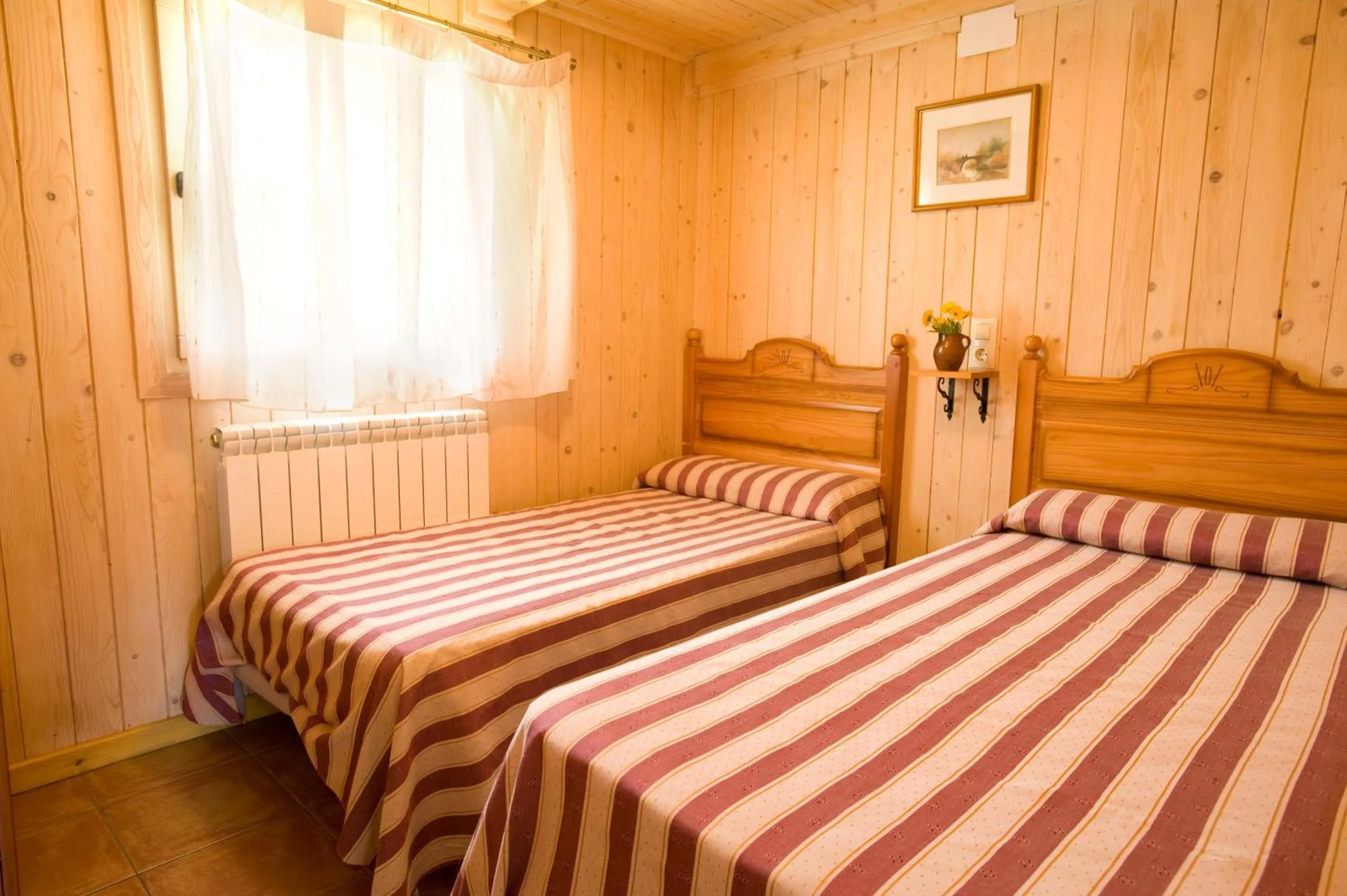 Bed in Bungalows La Borda d´Arnaldet