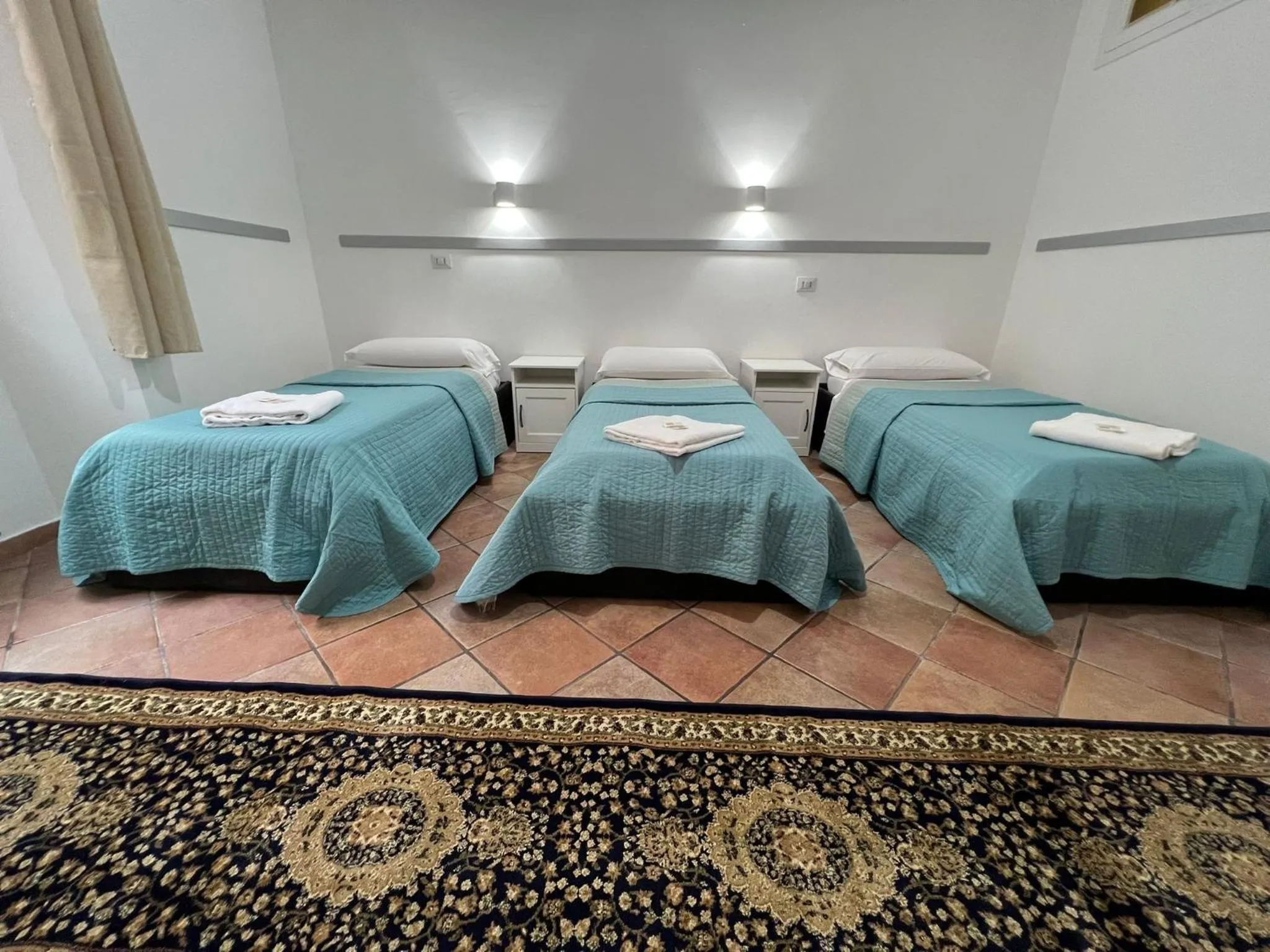 Quadruple Room with Outside Private Bathroom in Zidan Guest House