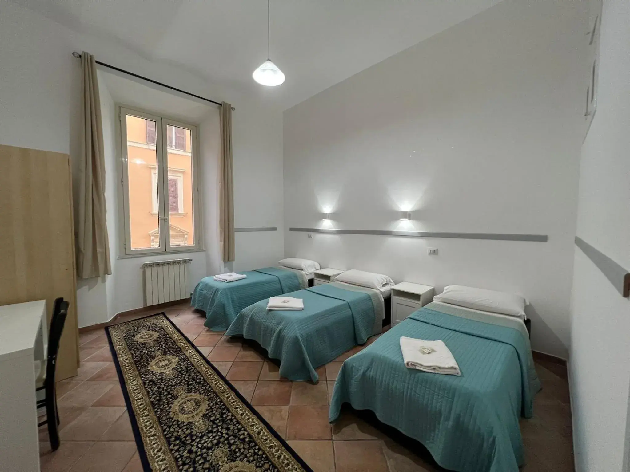 Quadruple Room with Outside Private Bathroom in Zidan Guest House Quadruple Room with Outside Private Bathroom in Zidan Guest House