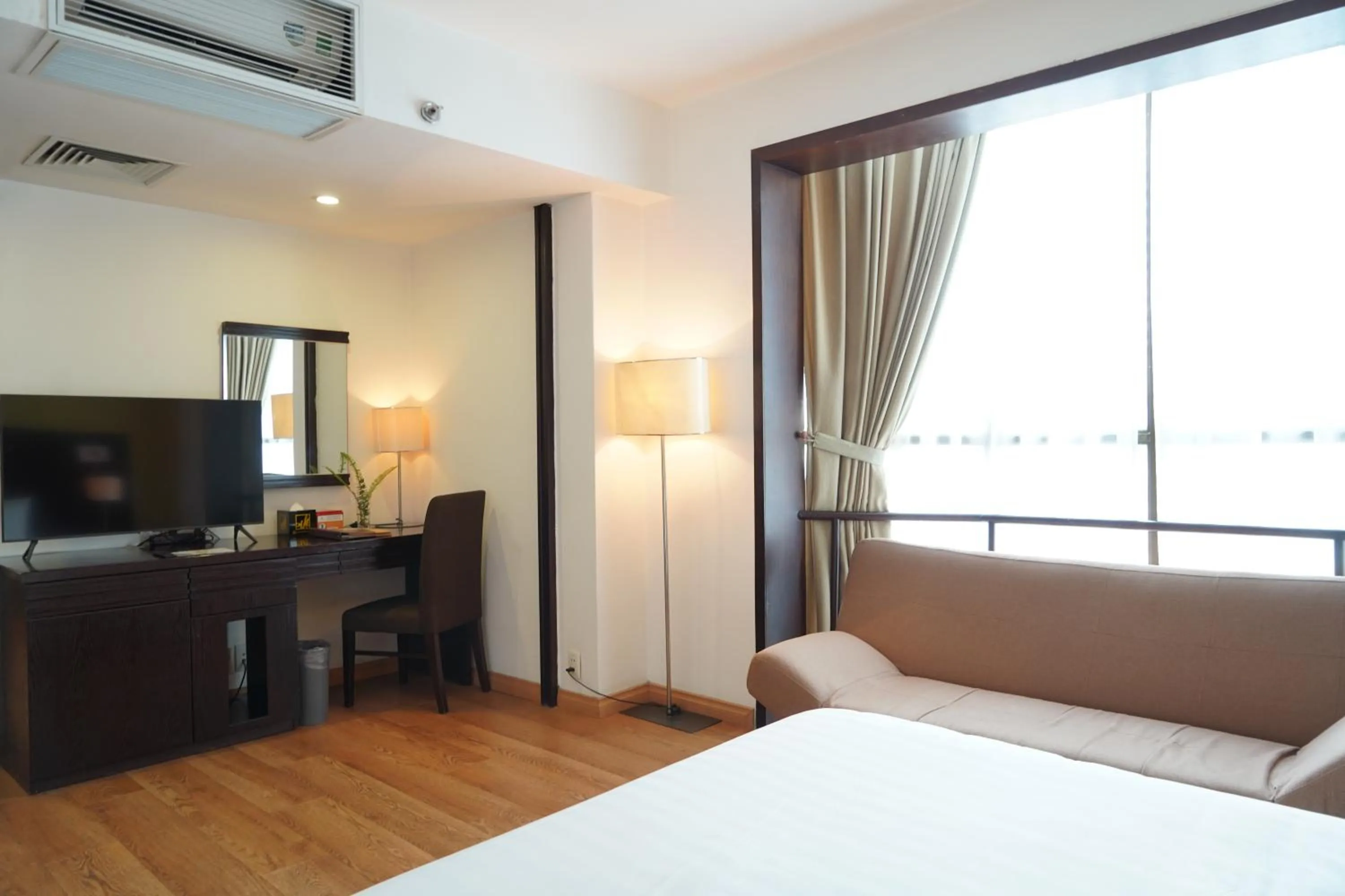 Living room, Bed in Bao Son International Hotel