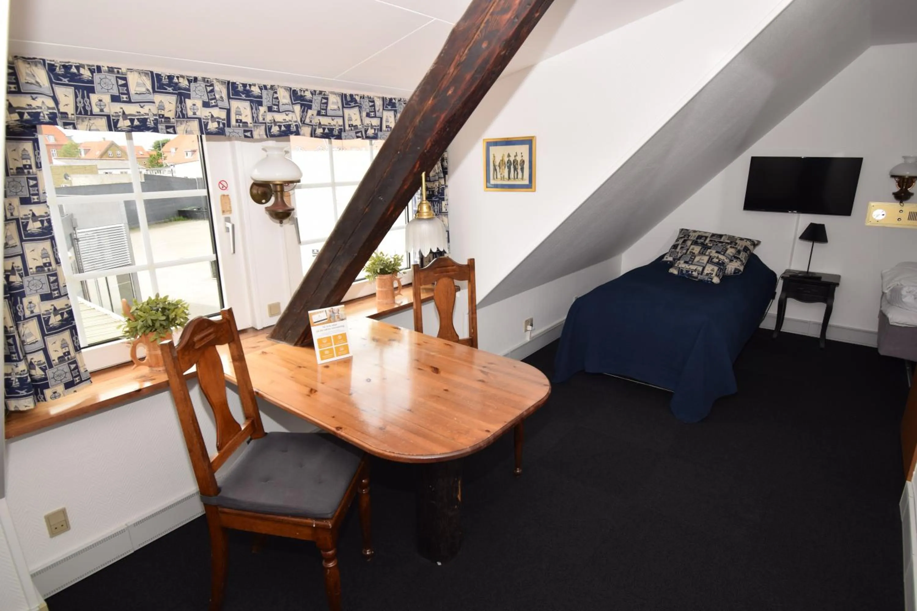 Seating area, Bed in Danhostel Frederikshavn City