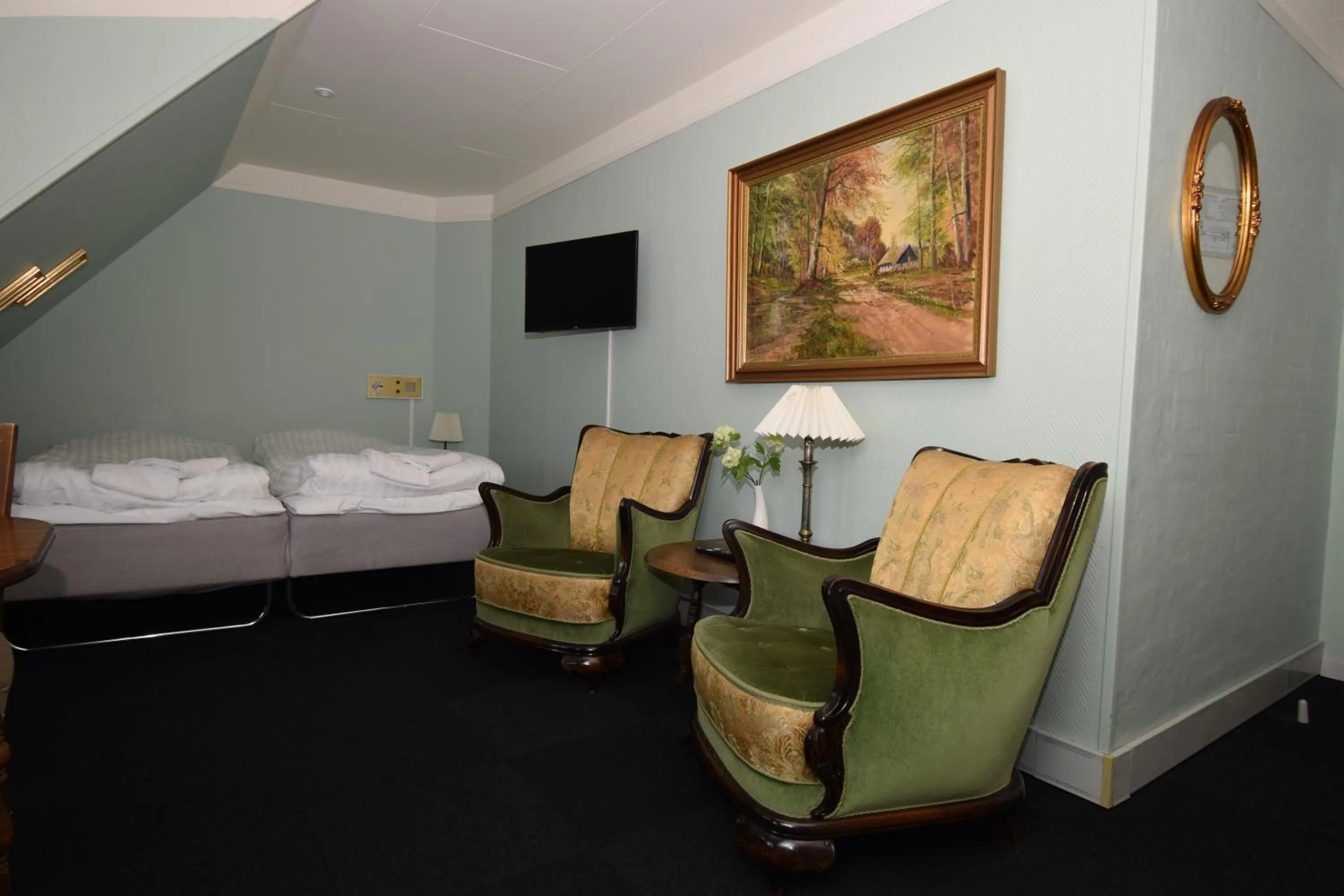 Seating area, Bed in Danhostel Frederikshavn City