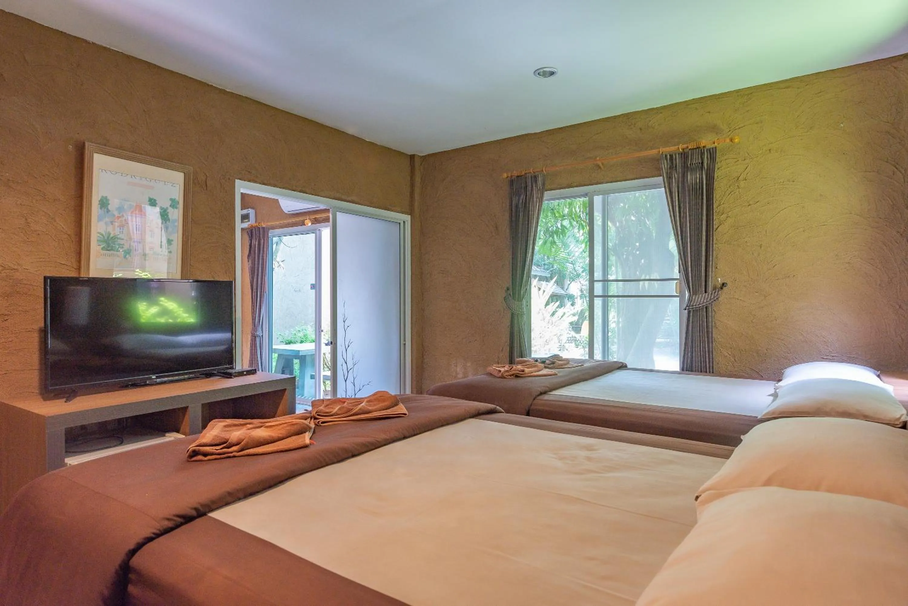 TV and multimedia, Bed in Muntra Garden Resort
