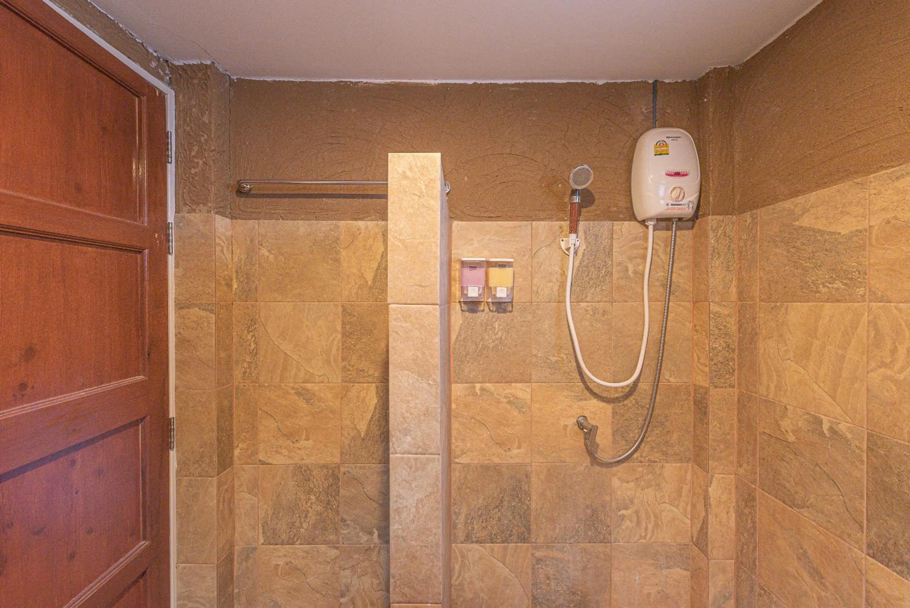 Shower in Muntra Garden Resort