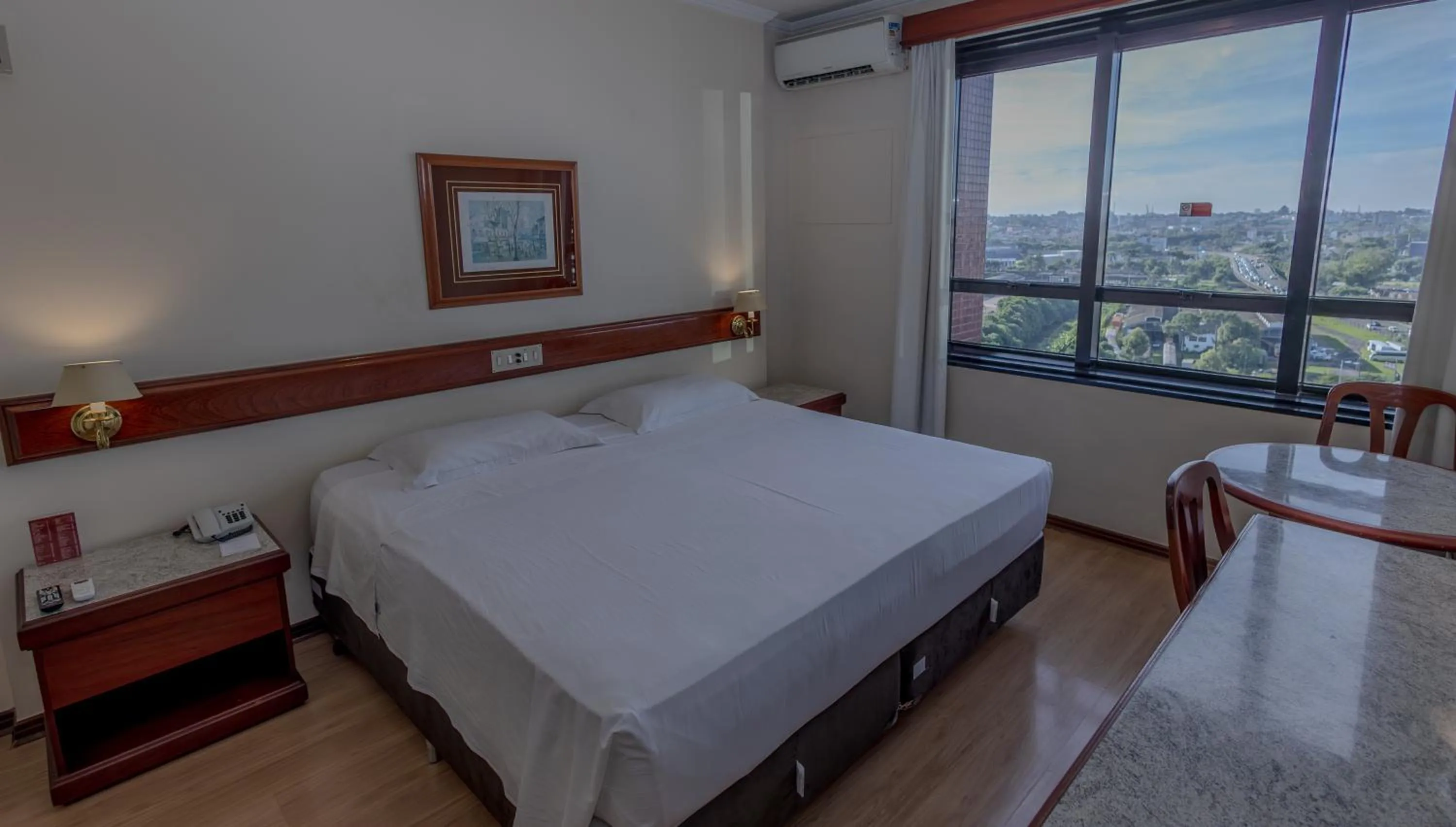 Bed in Lizon Curitiba Hotel