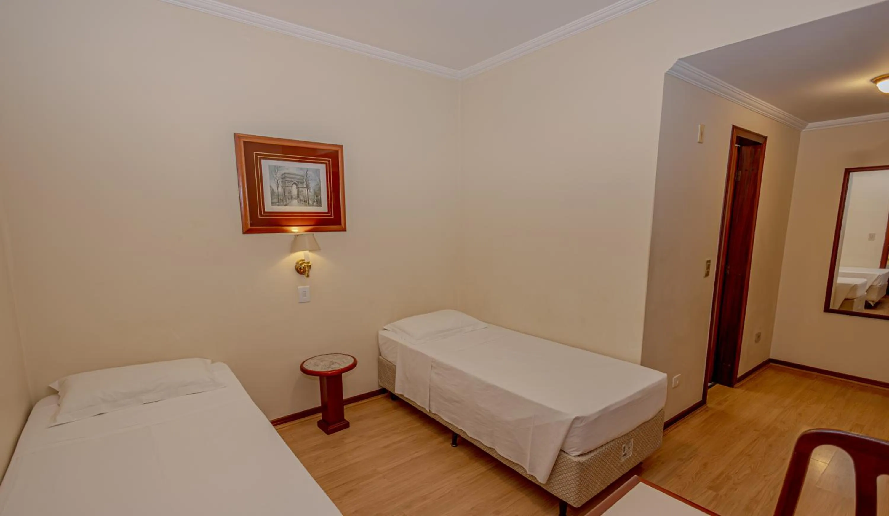 Bed in Lizon Curitiba Hotel