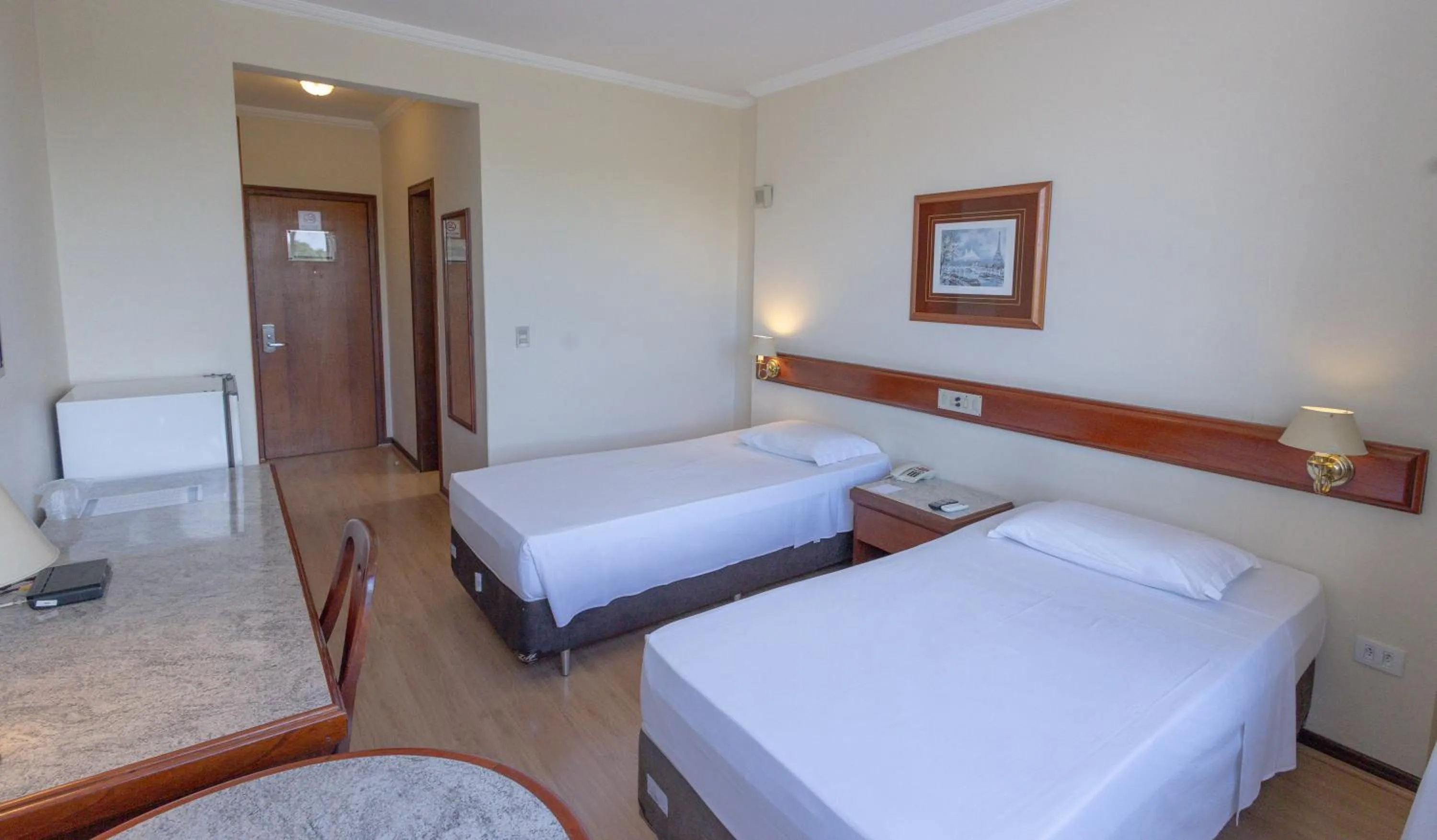 Bed in Lizon Curitiba Hotel