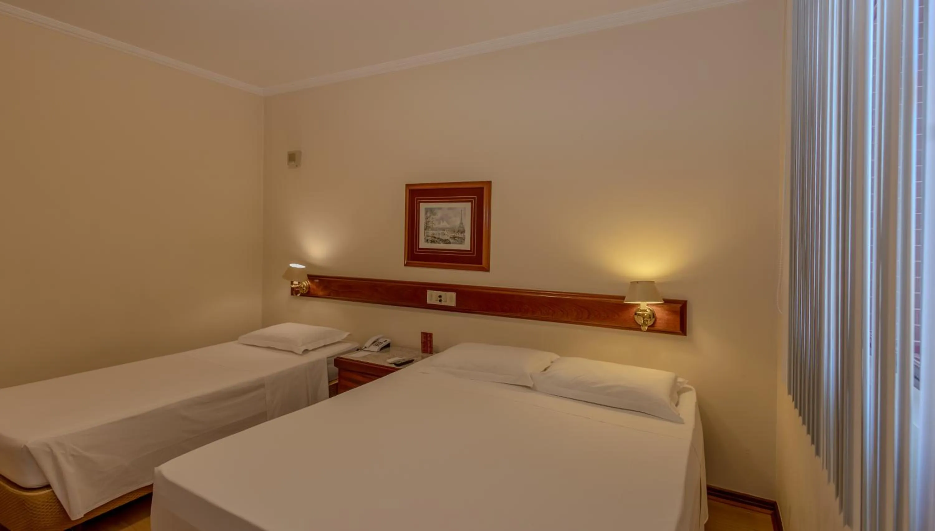 Bed in Lizon Curitiba Hotel