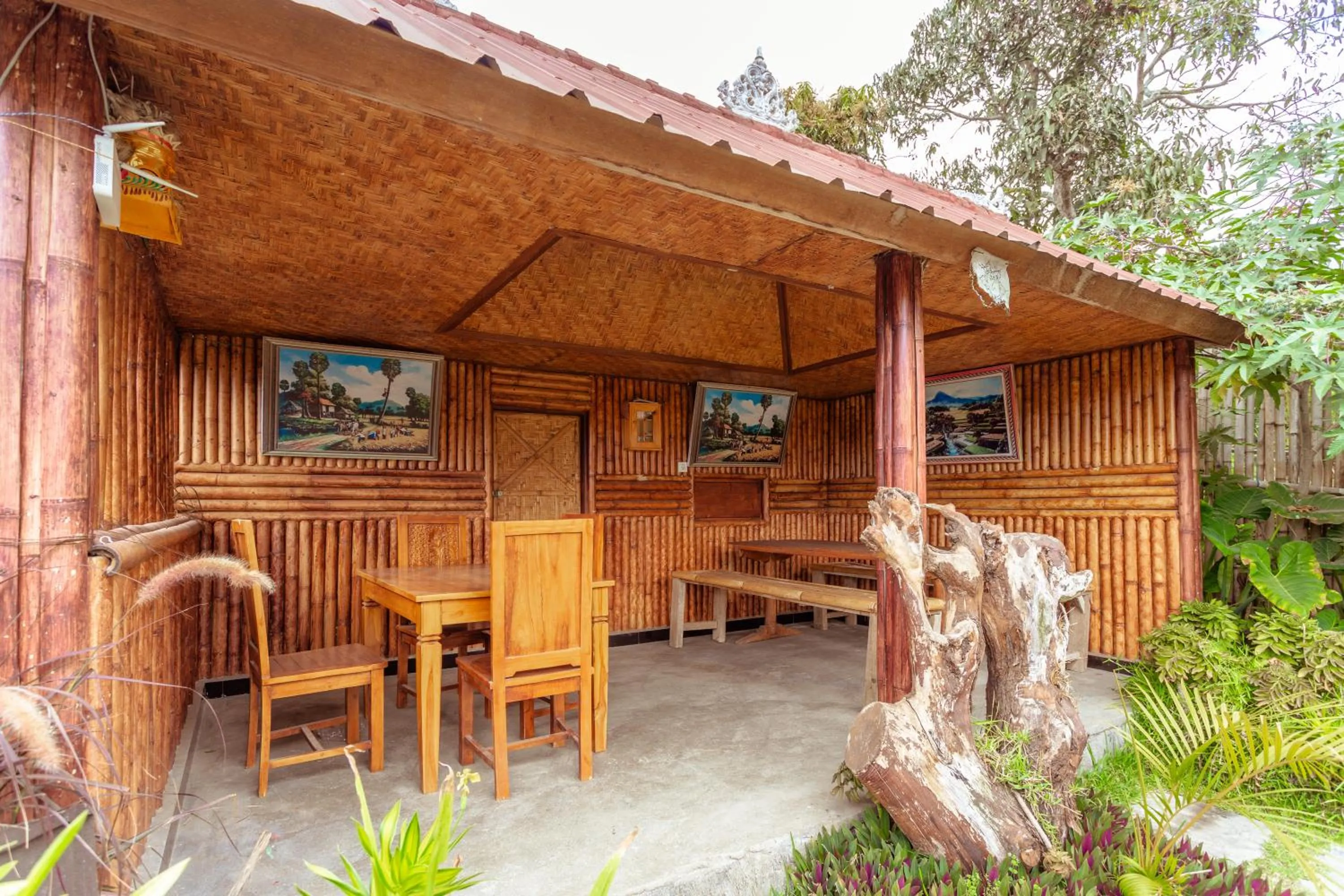 Seating area in Batur Bamboo Cabin by ecommerceloka