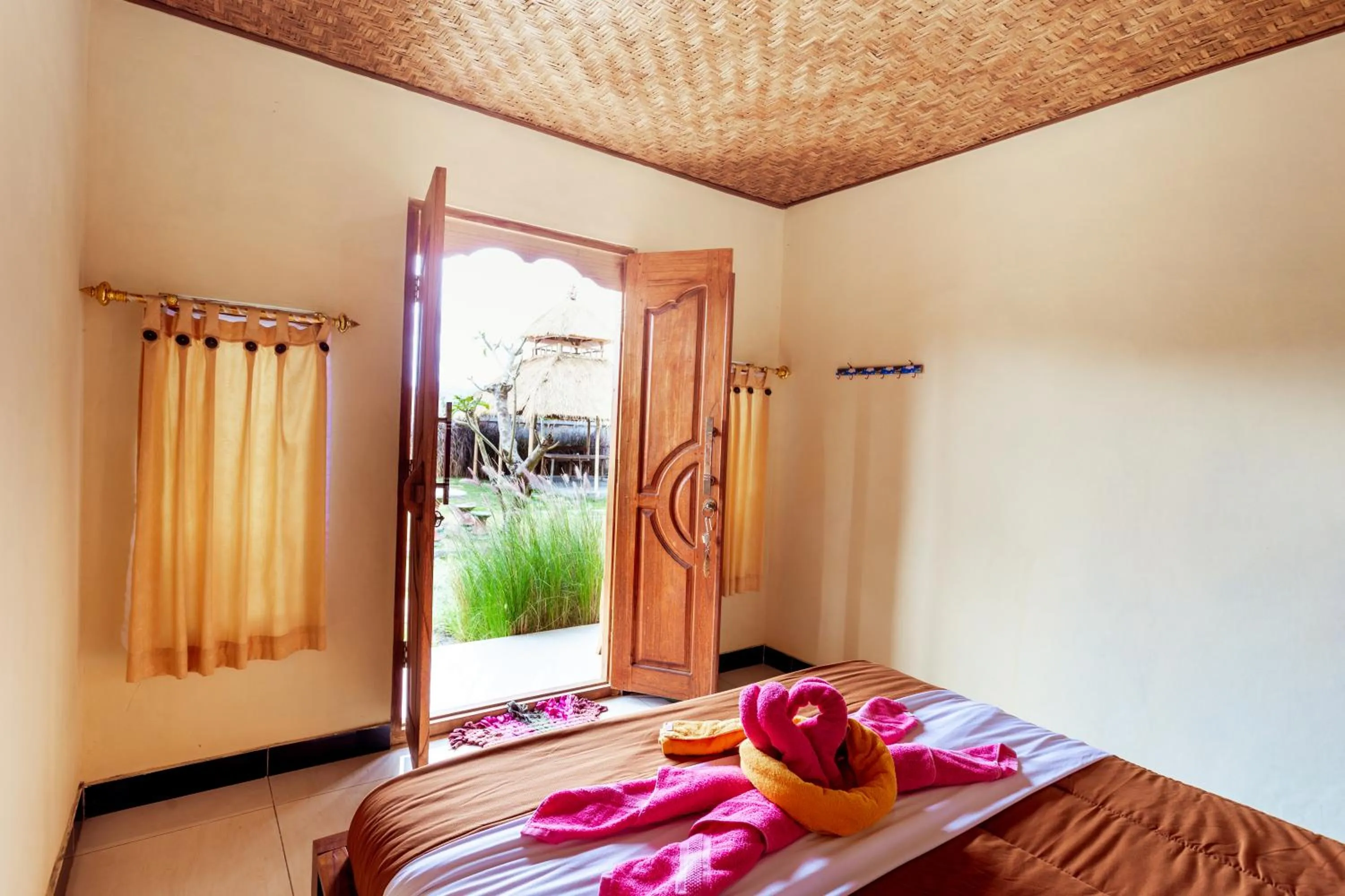 Bed in Batur Bamboo Cabin by ecommerceloka