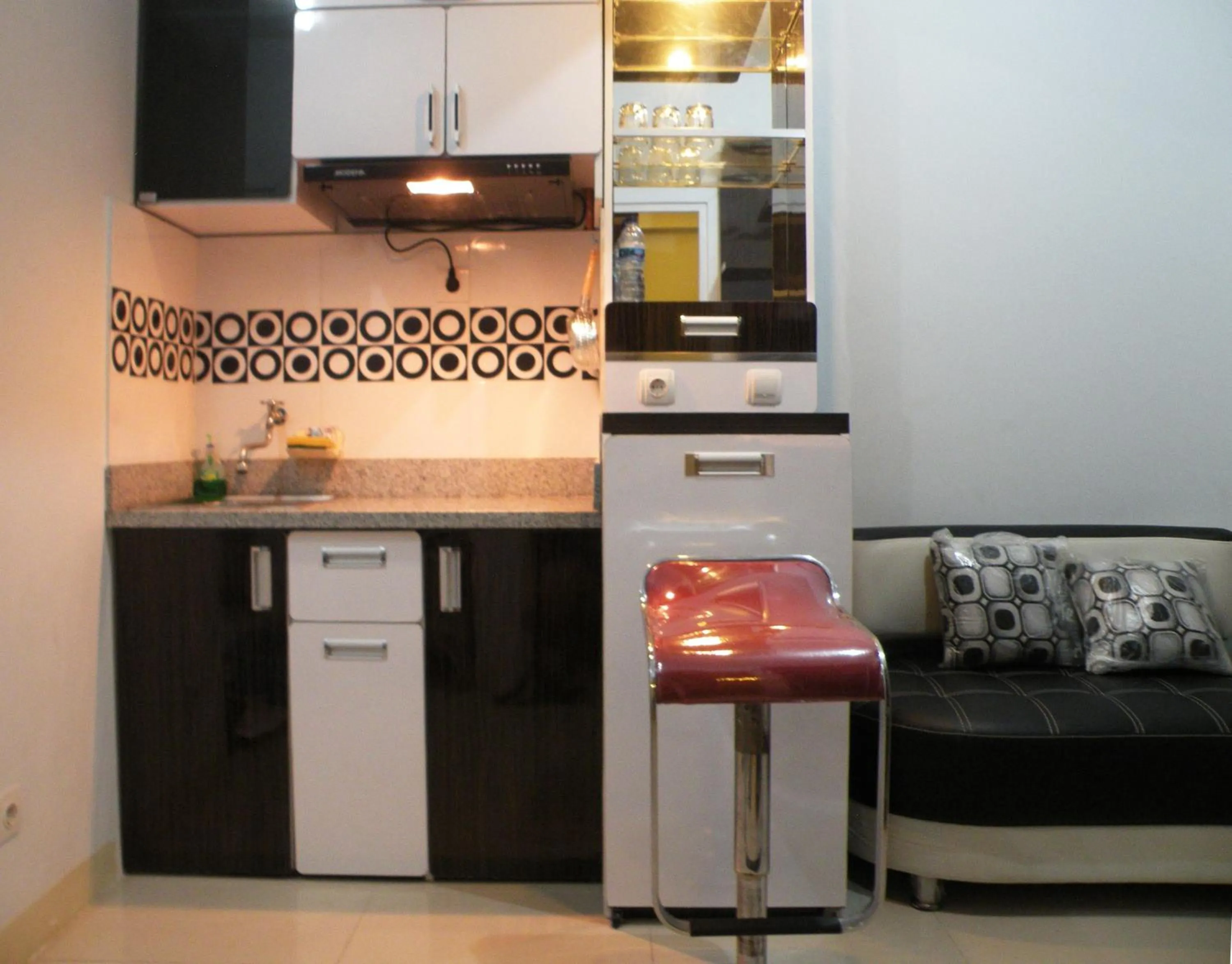 Kitchen or kitchenette in Apartment Green Pramuka ~ OCR