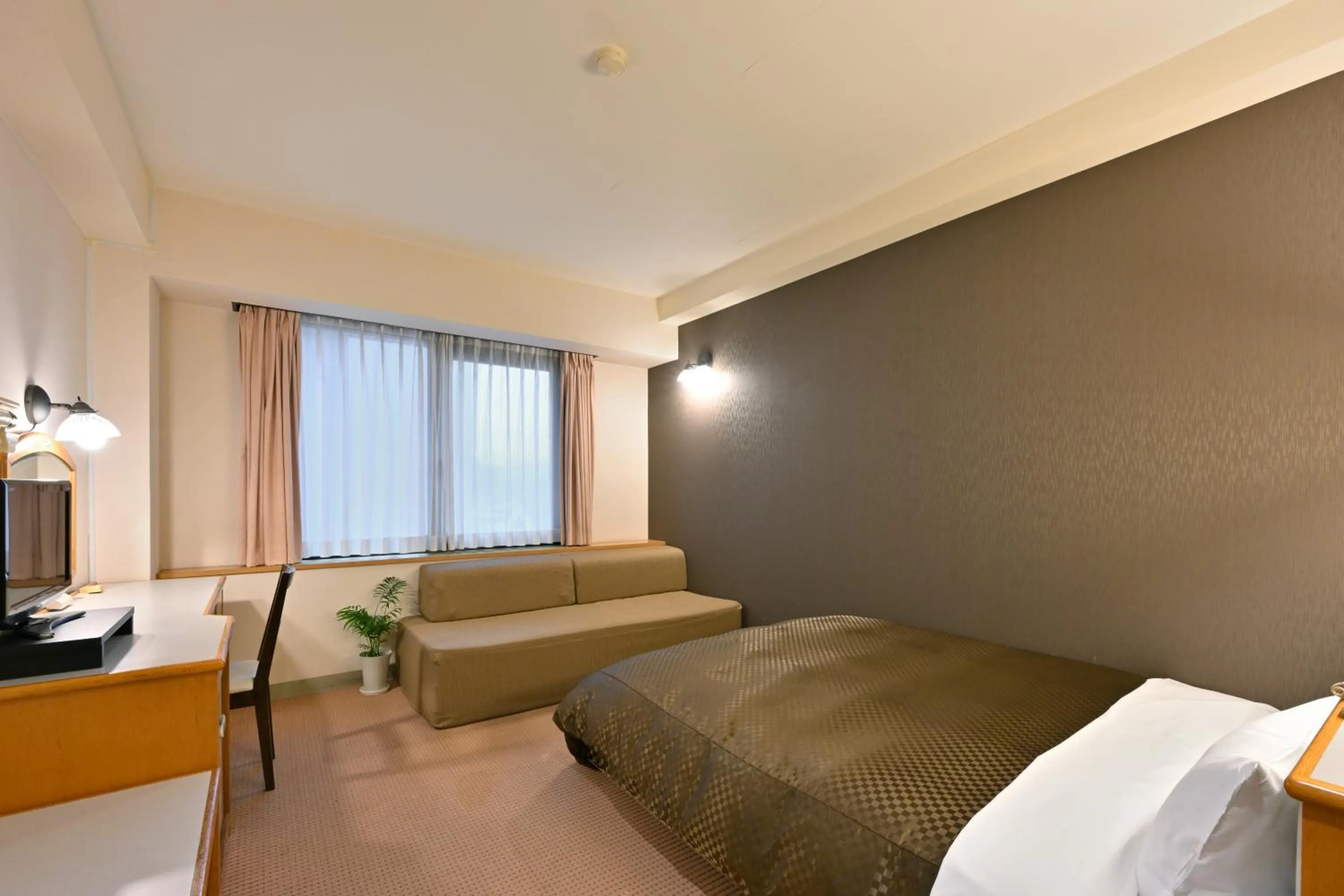 Bed in Miyajima Coral Hotel