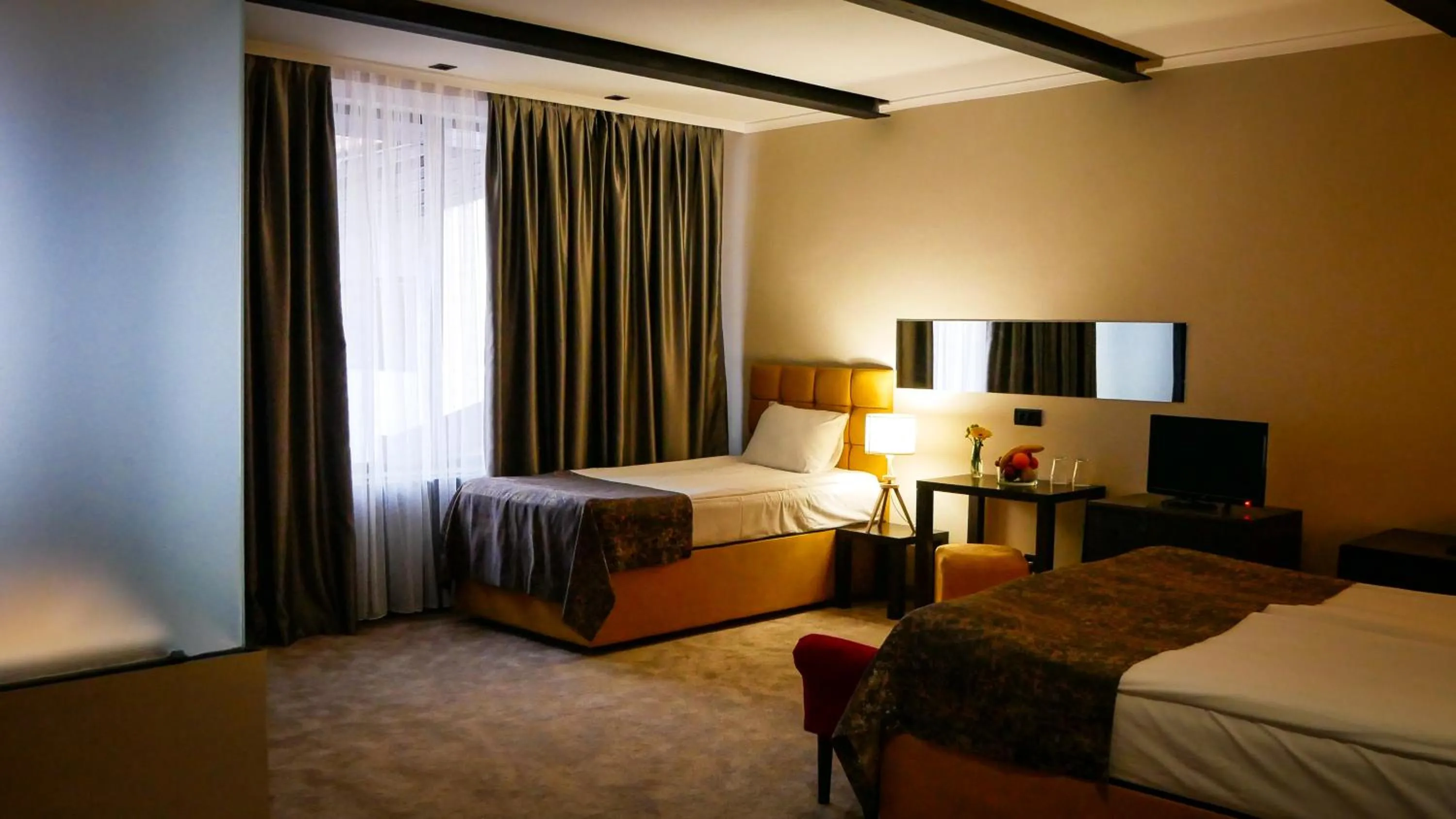 Photo of the whole room, Bed in Riverside Boutique Hotel