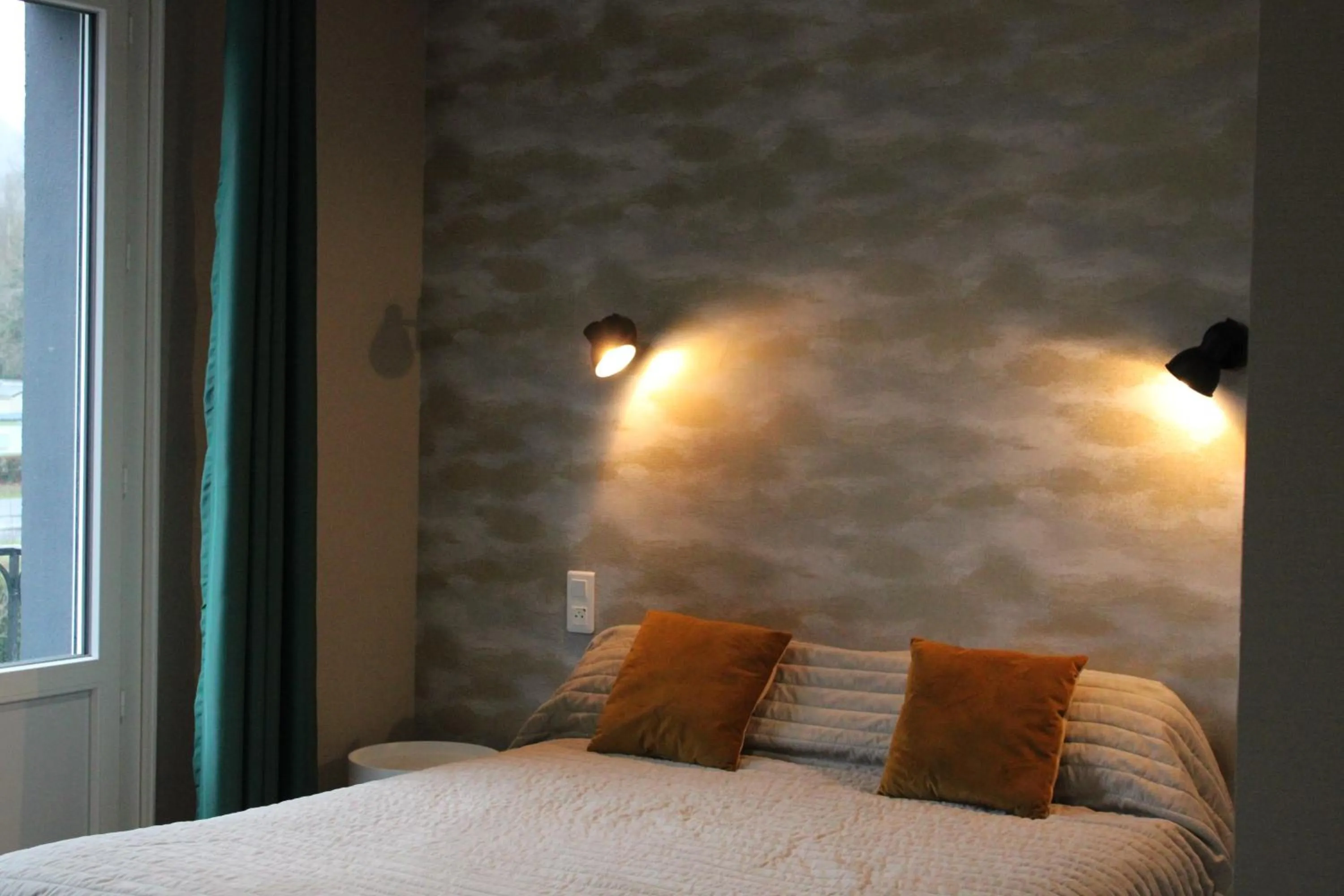 Bed in Logis Hôtel L'Ayguelade