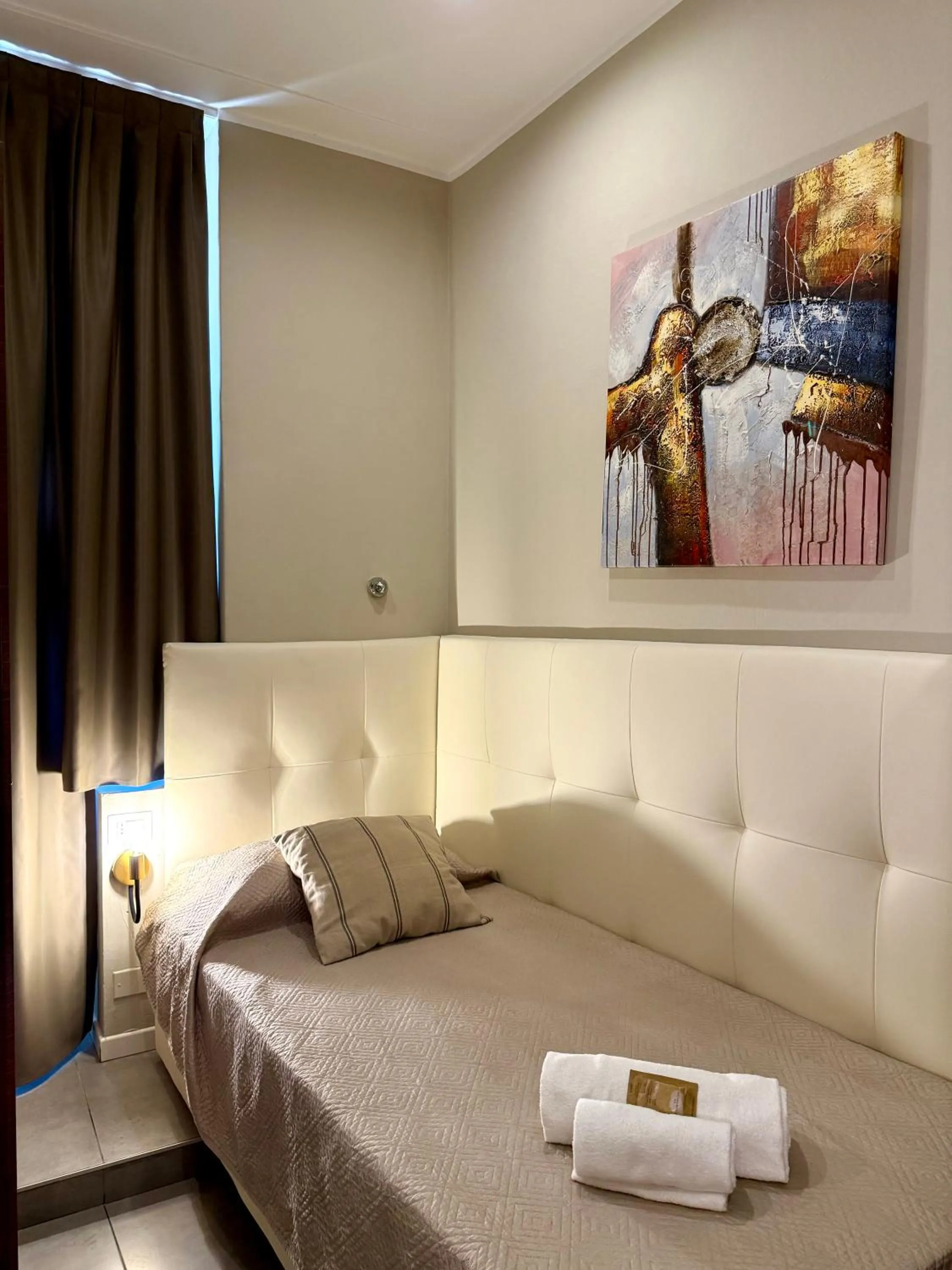 Bed in Carlo Goldoni Hotel