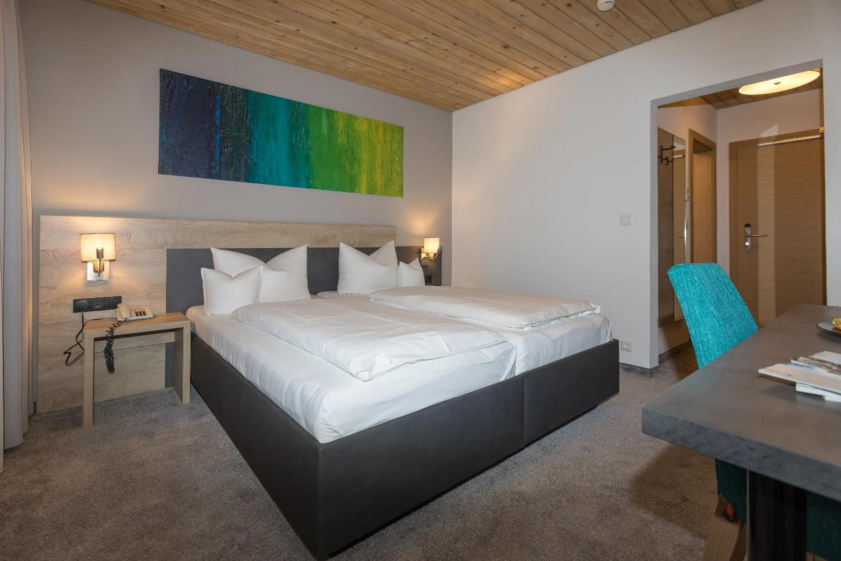 Bed in KOSIS Sports Lifestyle Hotel