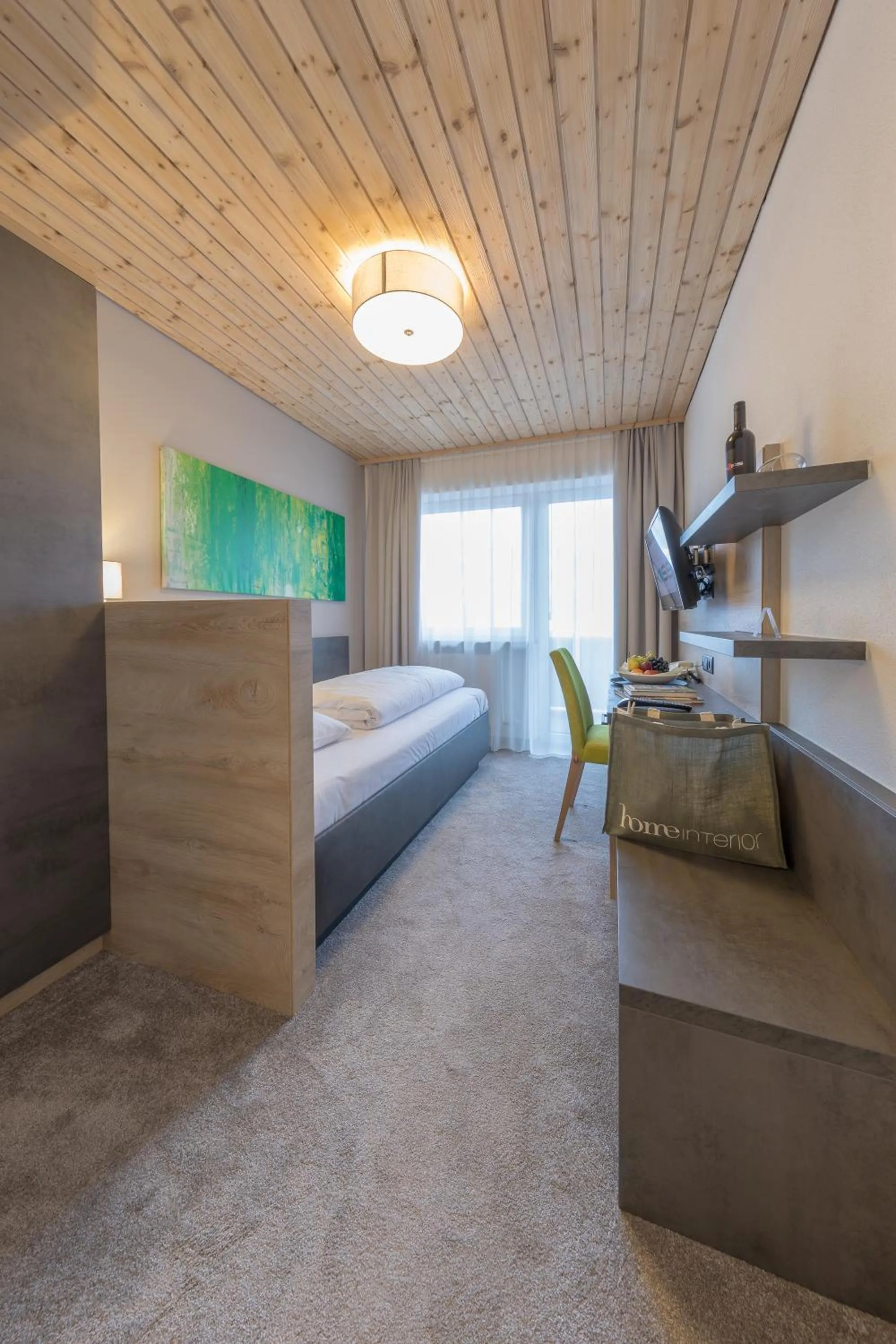 Bed in KOSIS Sports Lifestyle Hotel