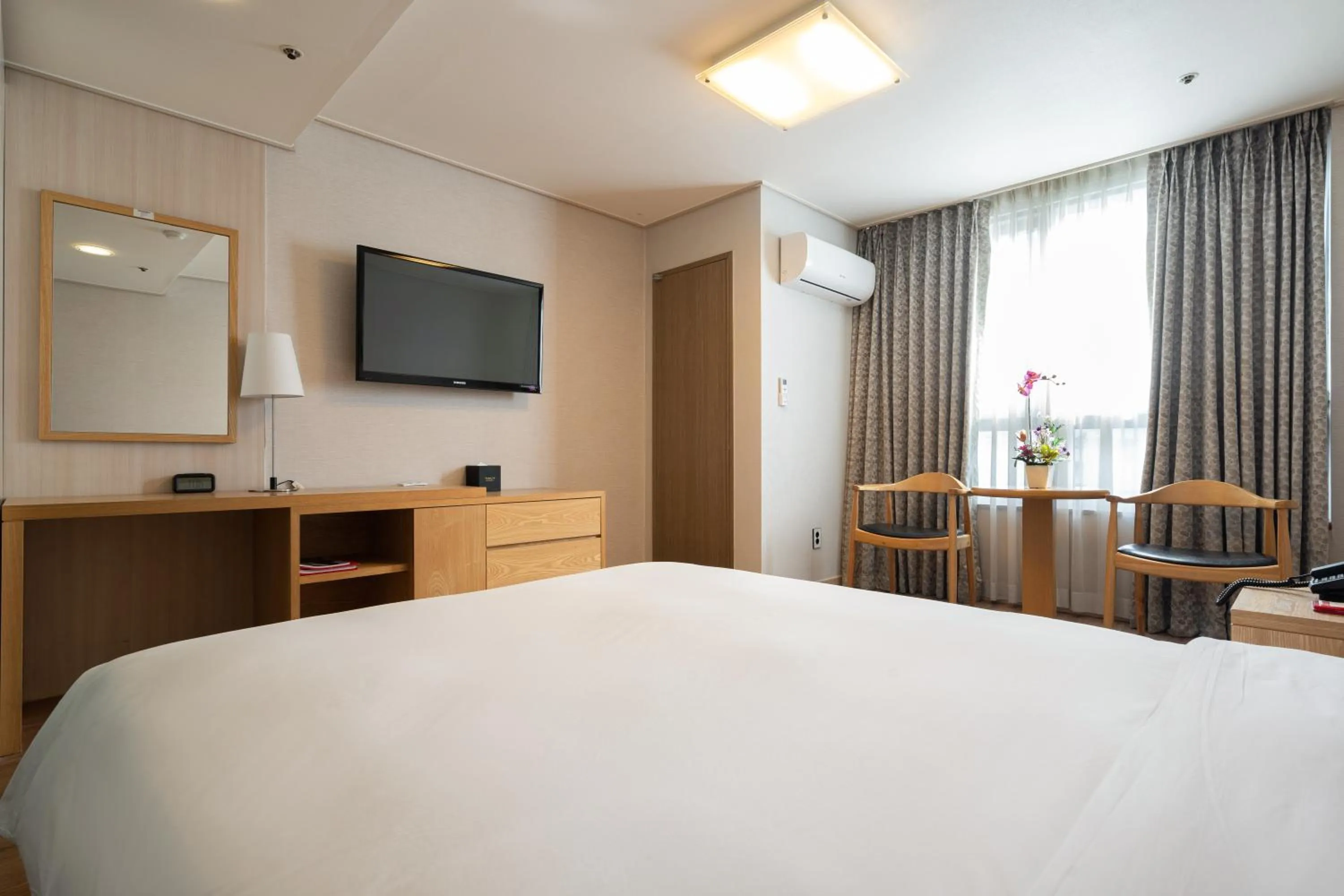 Bed in Ramada by Wyndham Seoul Dongdaemun