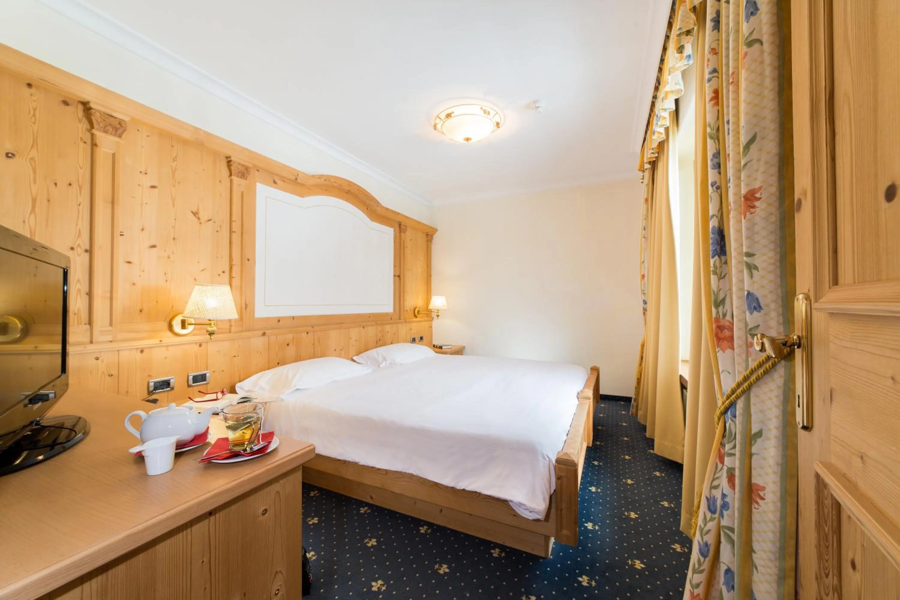 Bed in TH Corvara - Greif Hotel