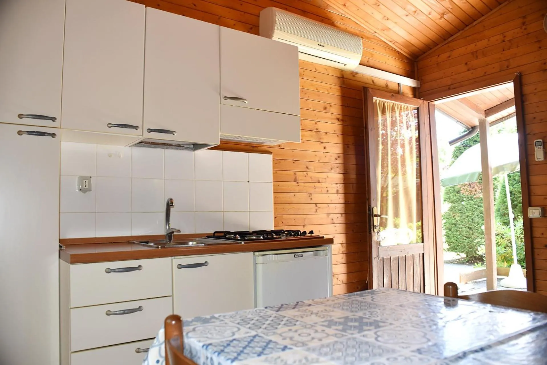 Kitchen or kitchenette in Club del Sole Adriano Family Camping Village