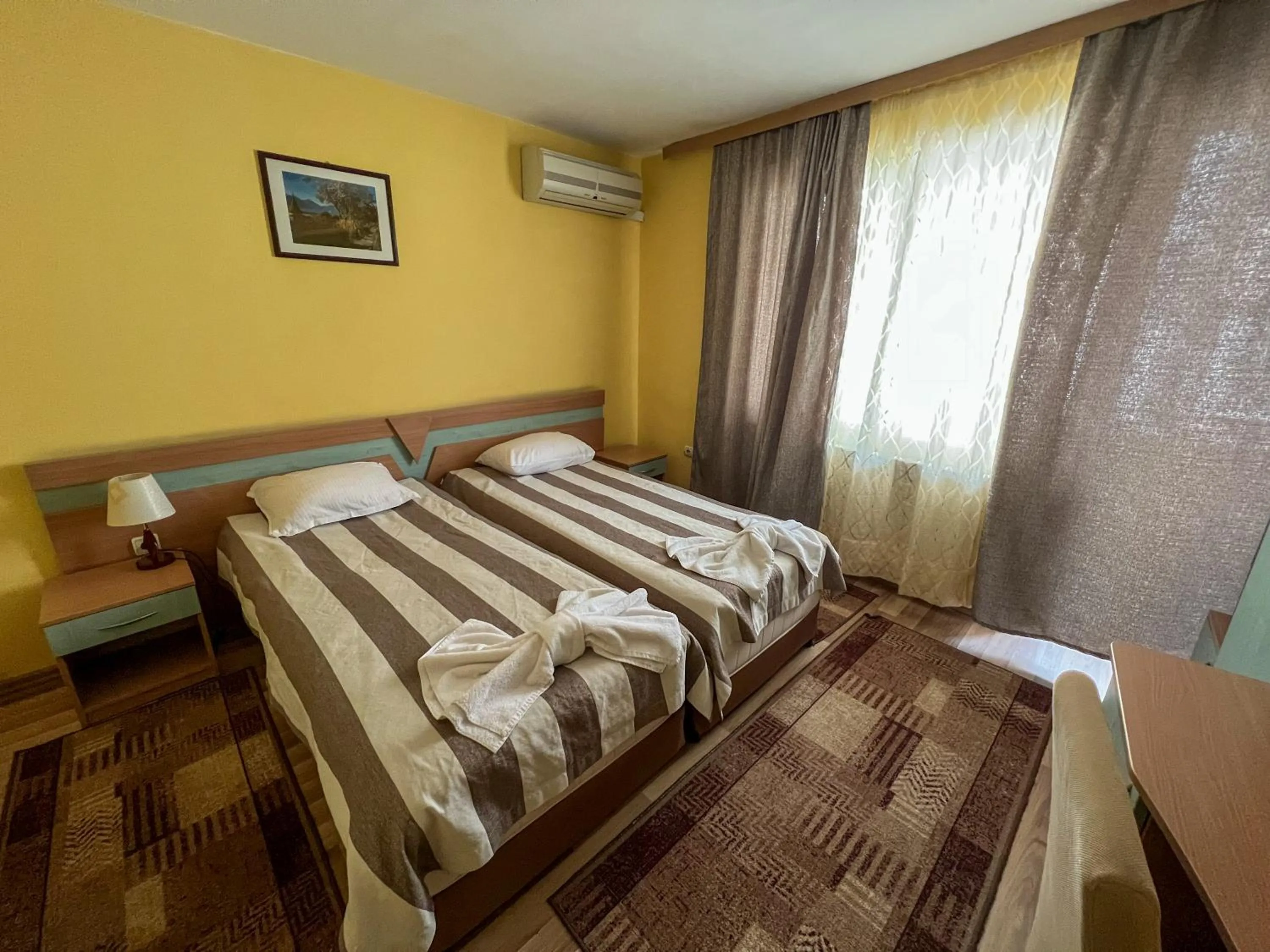 Bed in ALPHA family HOTEL