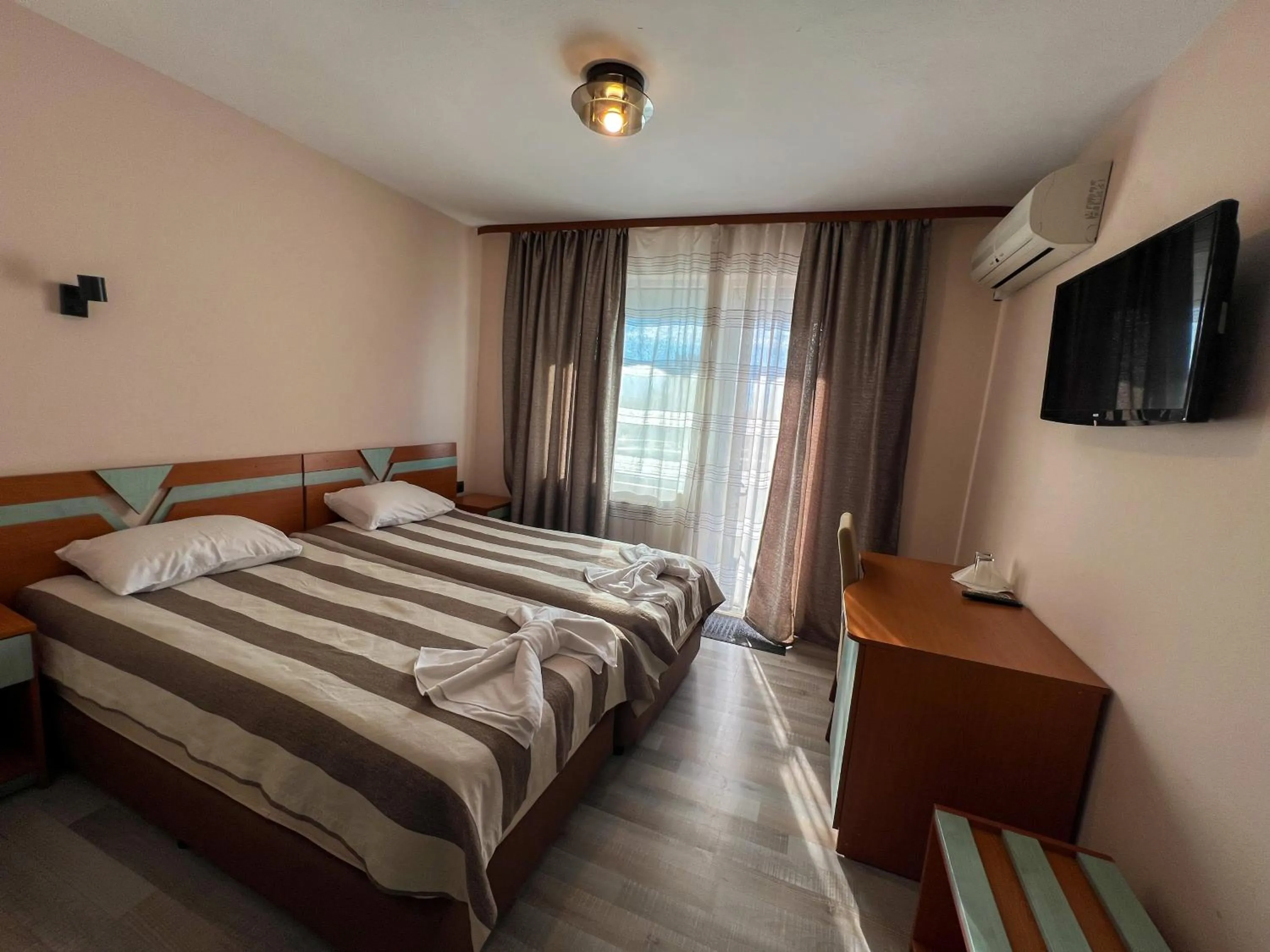 Bed in ALPHA family HOTEL