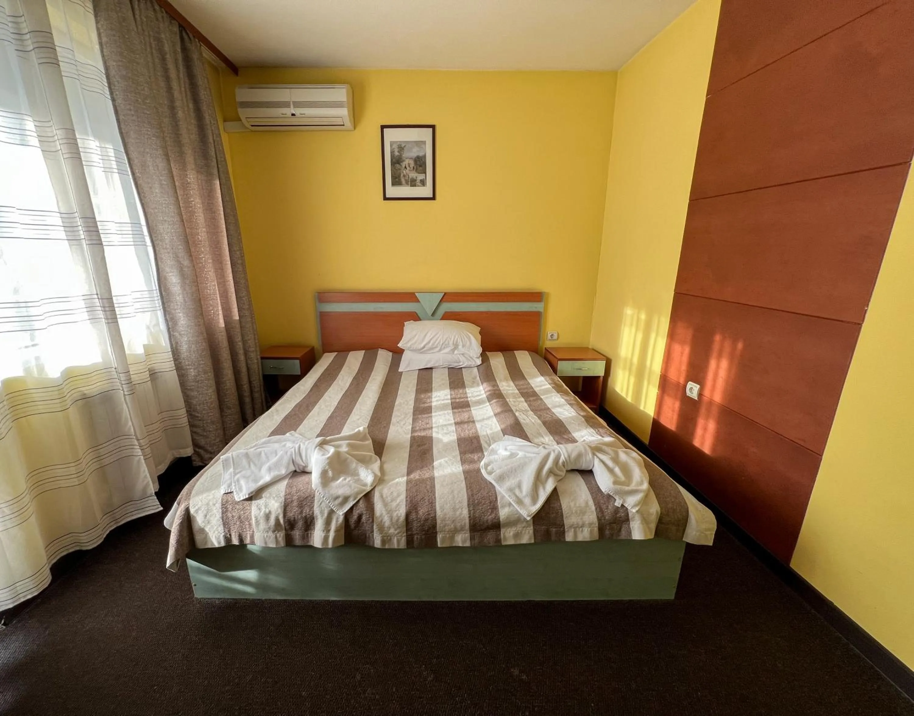 Bed in ALPHA family HOTEL