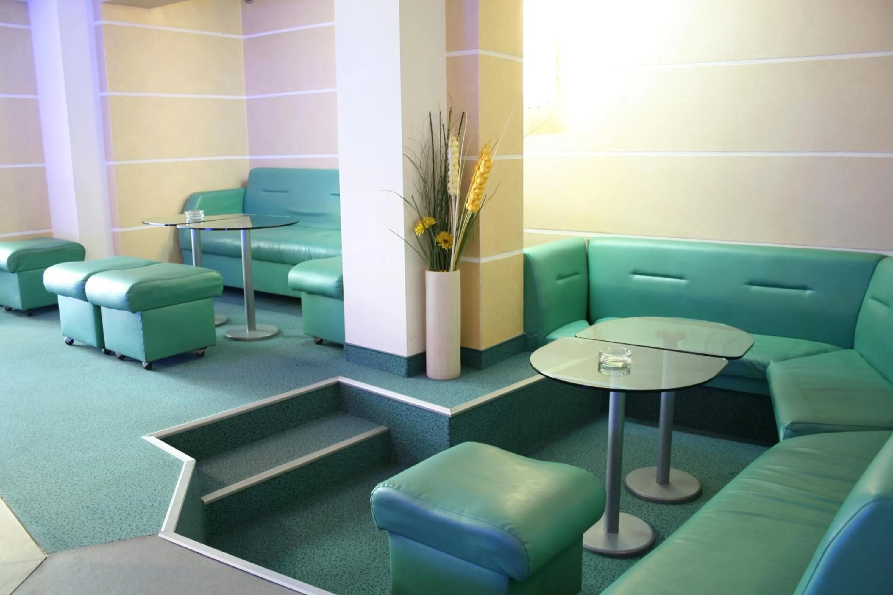 Communal lounge/ TV room in ALPHA family HOTEL