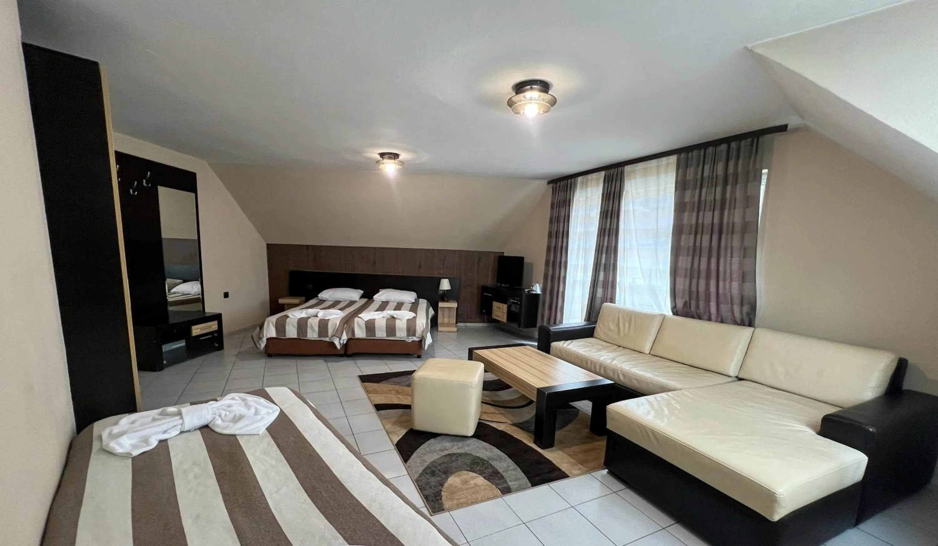 Bed in ALPHA family HOTEL