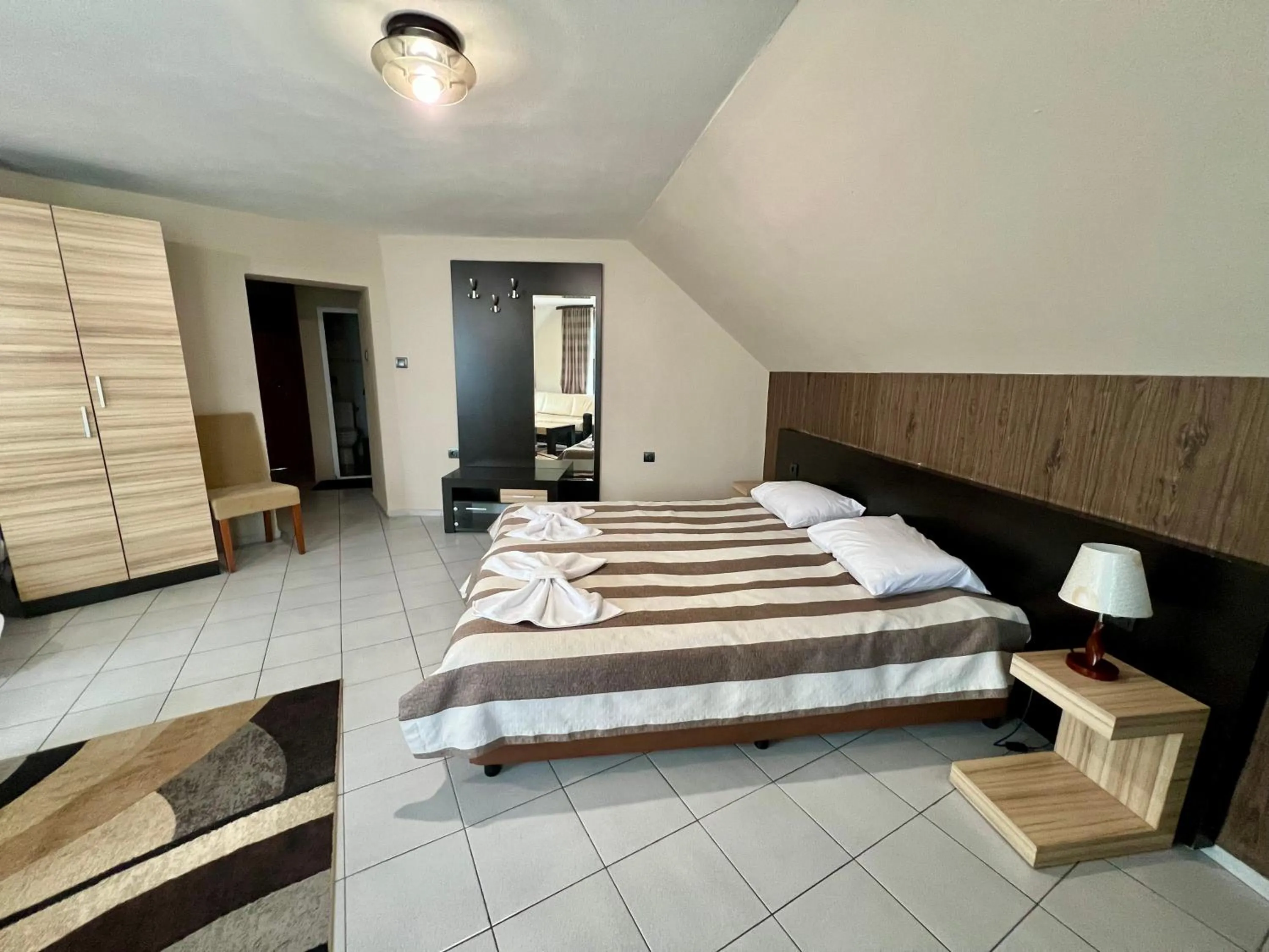 Bed in ALPHA family HOTEL