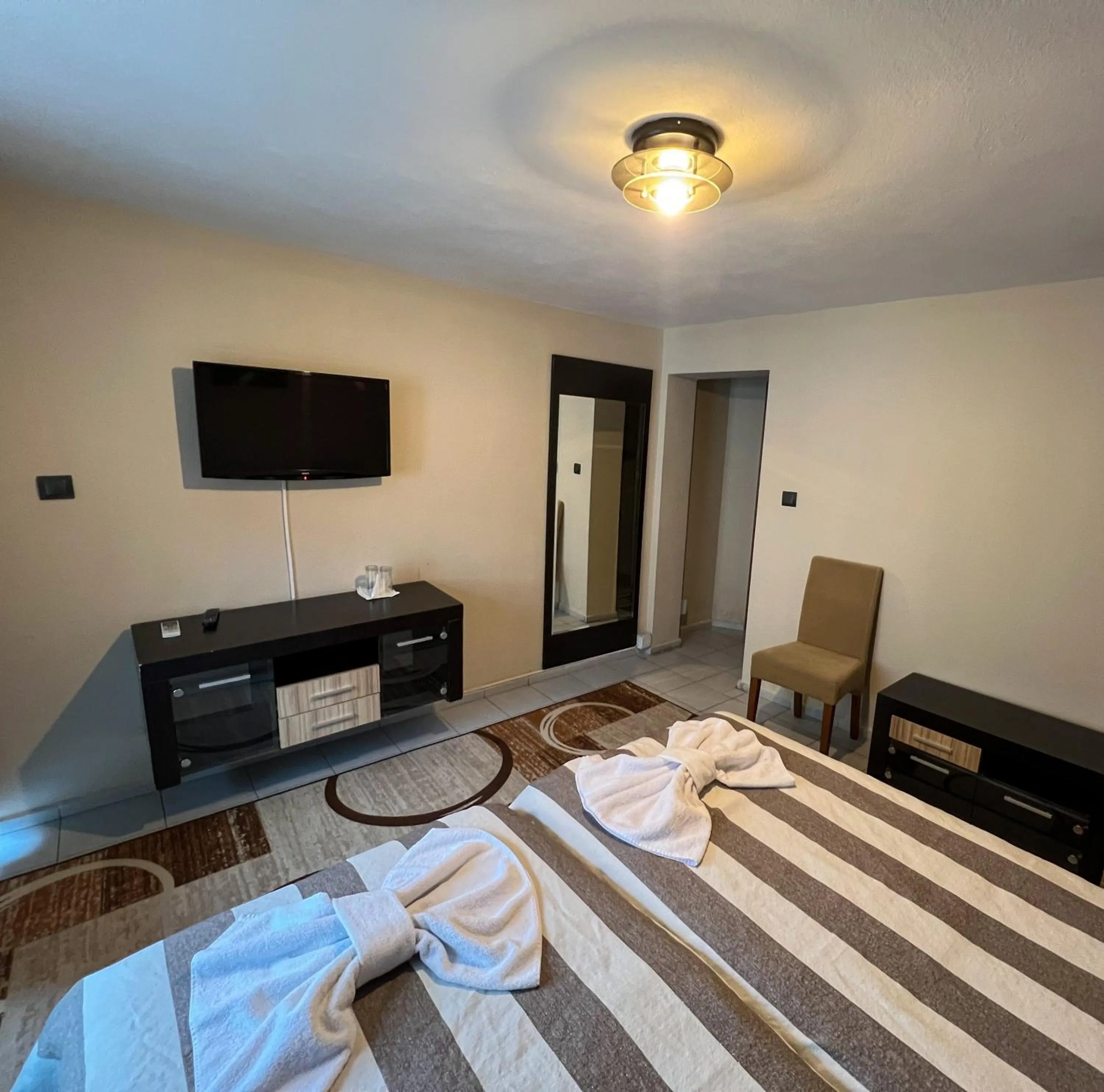 Bed in ALPHA family HOTEL